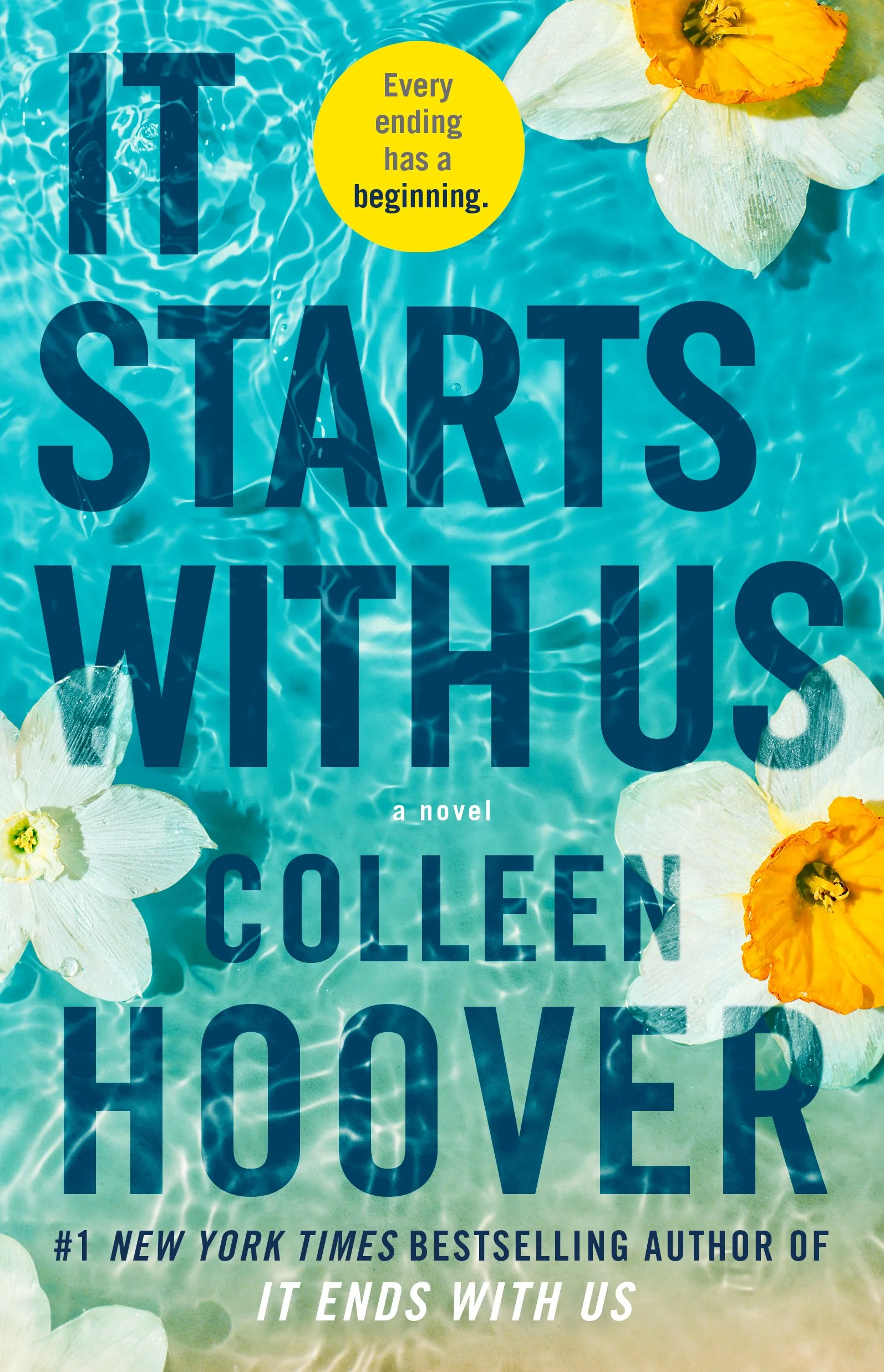 Paperback cover of IT STARTS WITH US by Colleen Hoover. White daffodils with yellow centers float in clear aqua water with a sandy border on the bottom.
