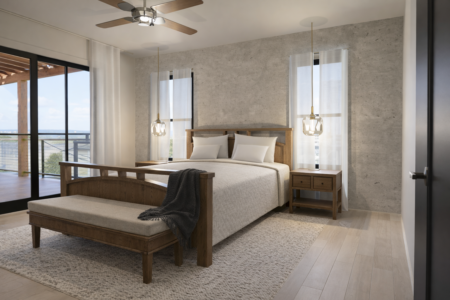 Bedroom with seating and sliding glass door opening to a balcony.
