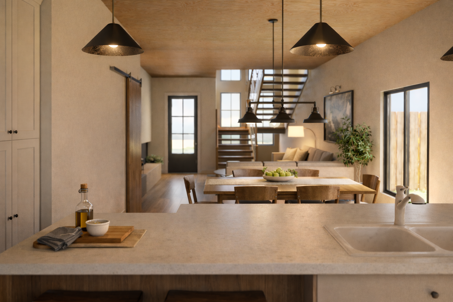 Open kitchen and living area with connected dining space and large windows.
