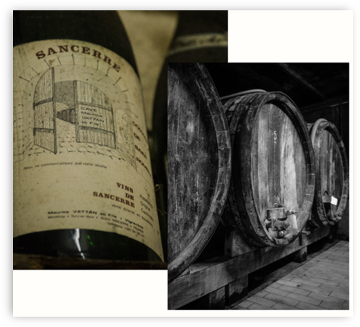 Wine bottles and large wooden wine barrels in a winery