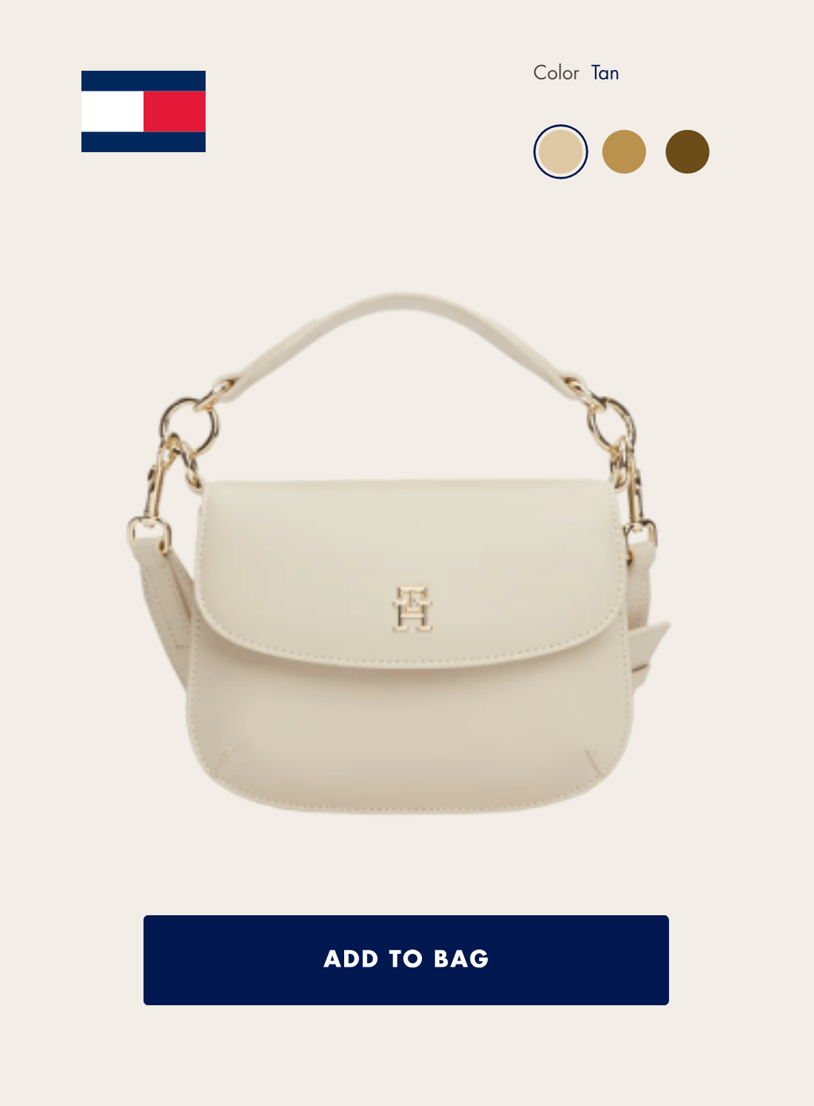 Tommy hilfiger cream-colored handbag with gold chain strap and a gold logo on the front, displayed on a product page with an option for 'Tan' color.
