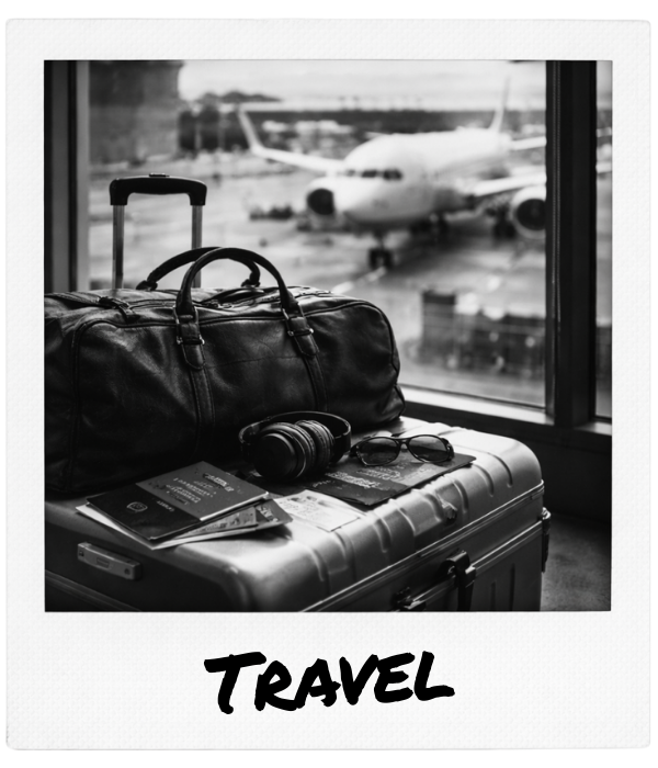 Travel essentials including a duffel bag, headphones, sunglasses, passport, and a small suitcase near an airport window with an airplane outside.