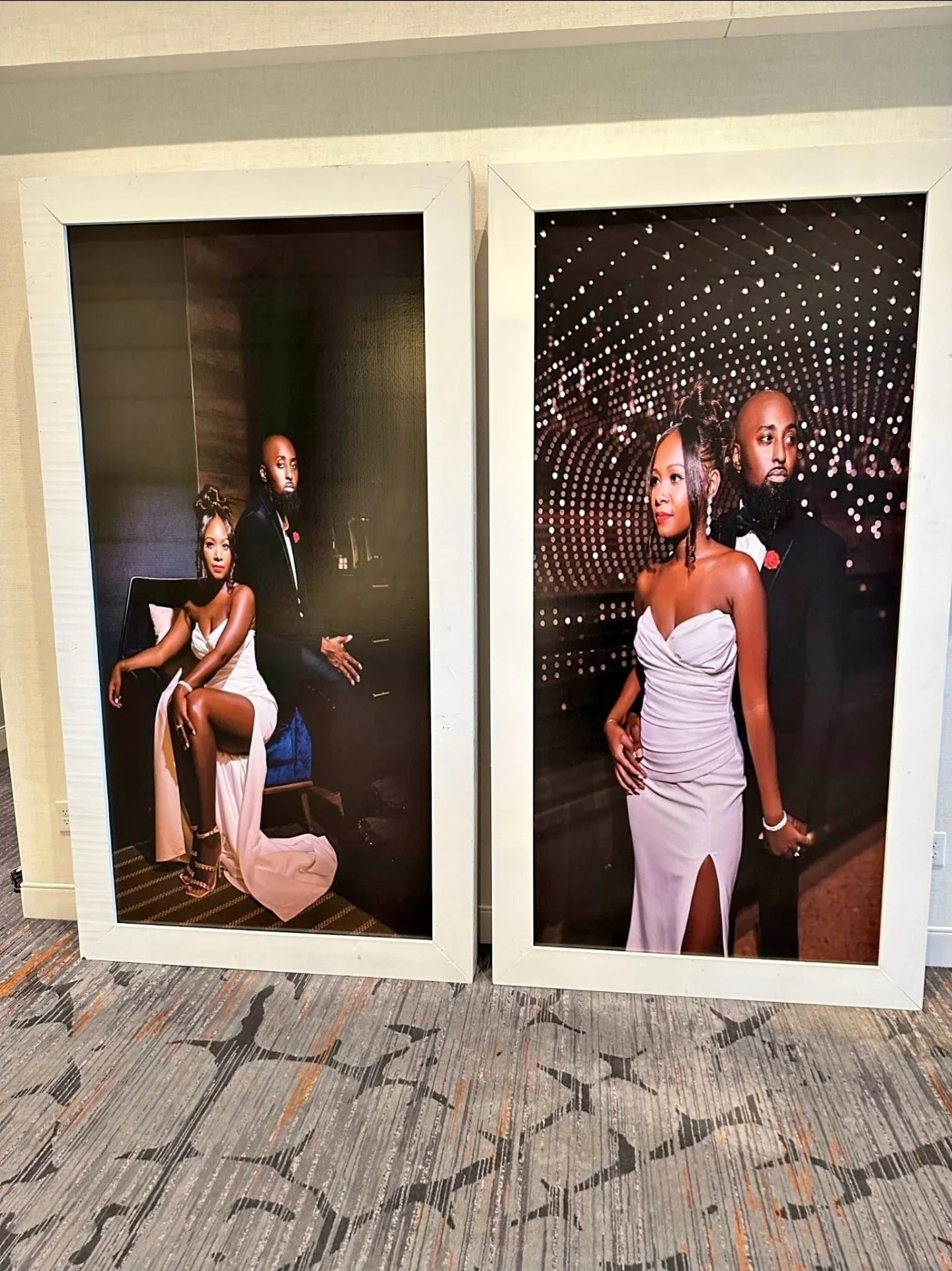 Two framed photographs of the same couple in formal attire, displayed on a patterned carpeted floor. The woman wears a white strapless gown, and the man is in a black tuxedo with a bow tie. In the left photo, they are posing indoors with a dark backg
