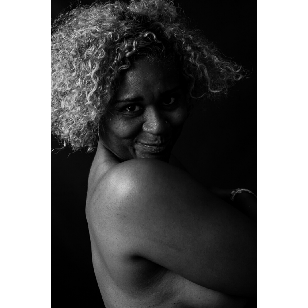 a woman sheepishly smiles