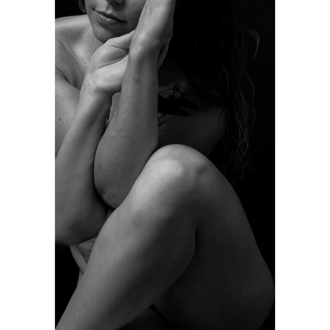 close-up image of a woman in an artistic yoga pose