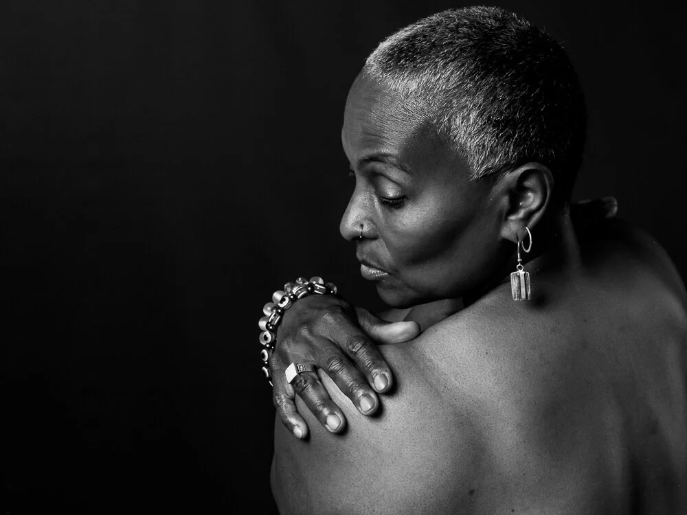 A woman looks over her shoulder