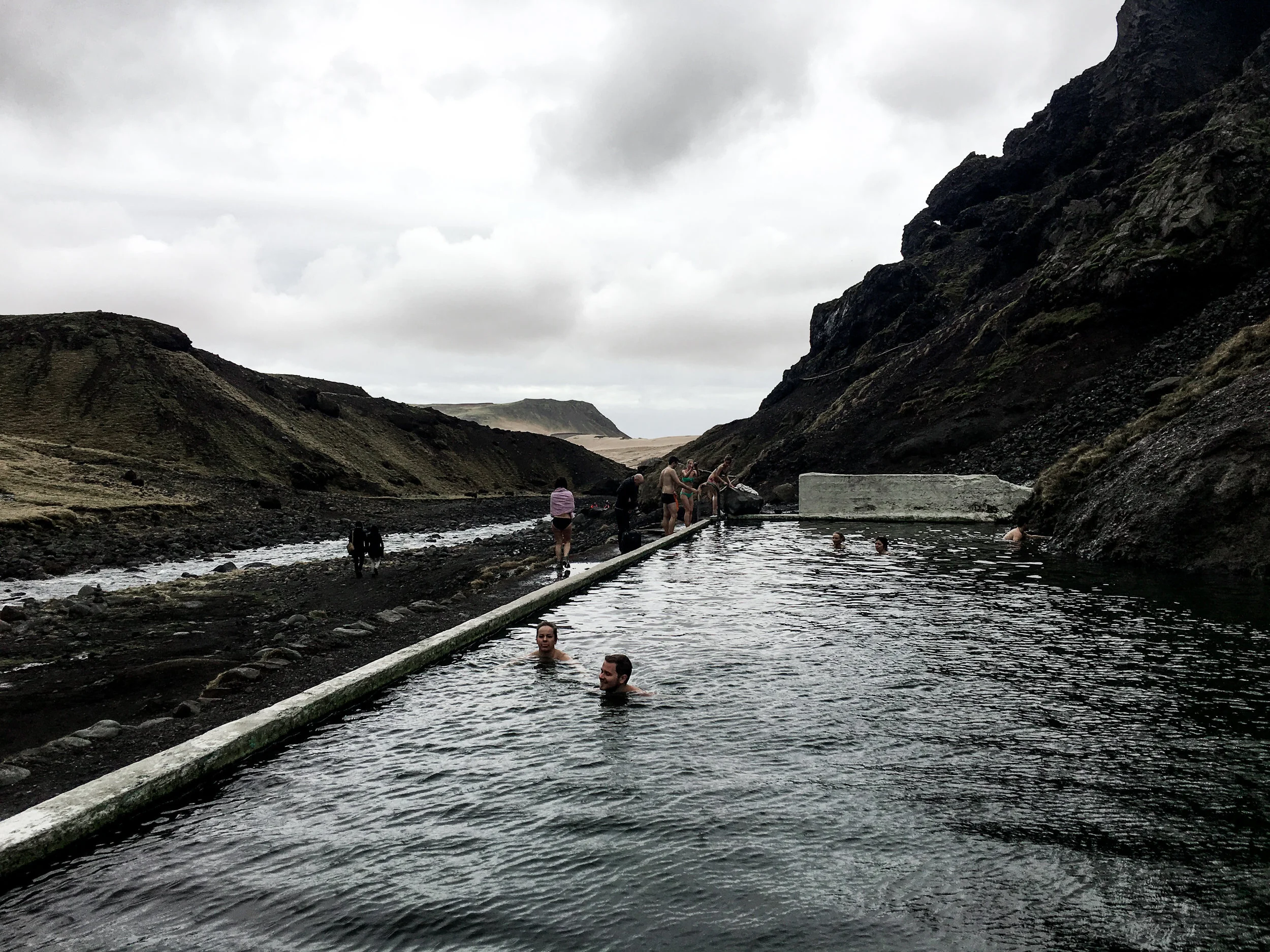 A natural spring in Iceland attracts tourists and swimmers