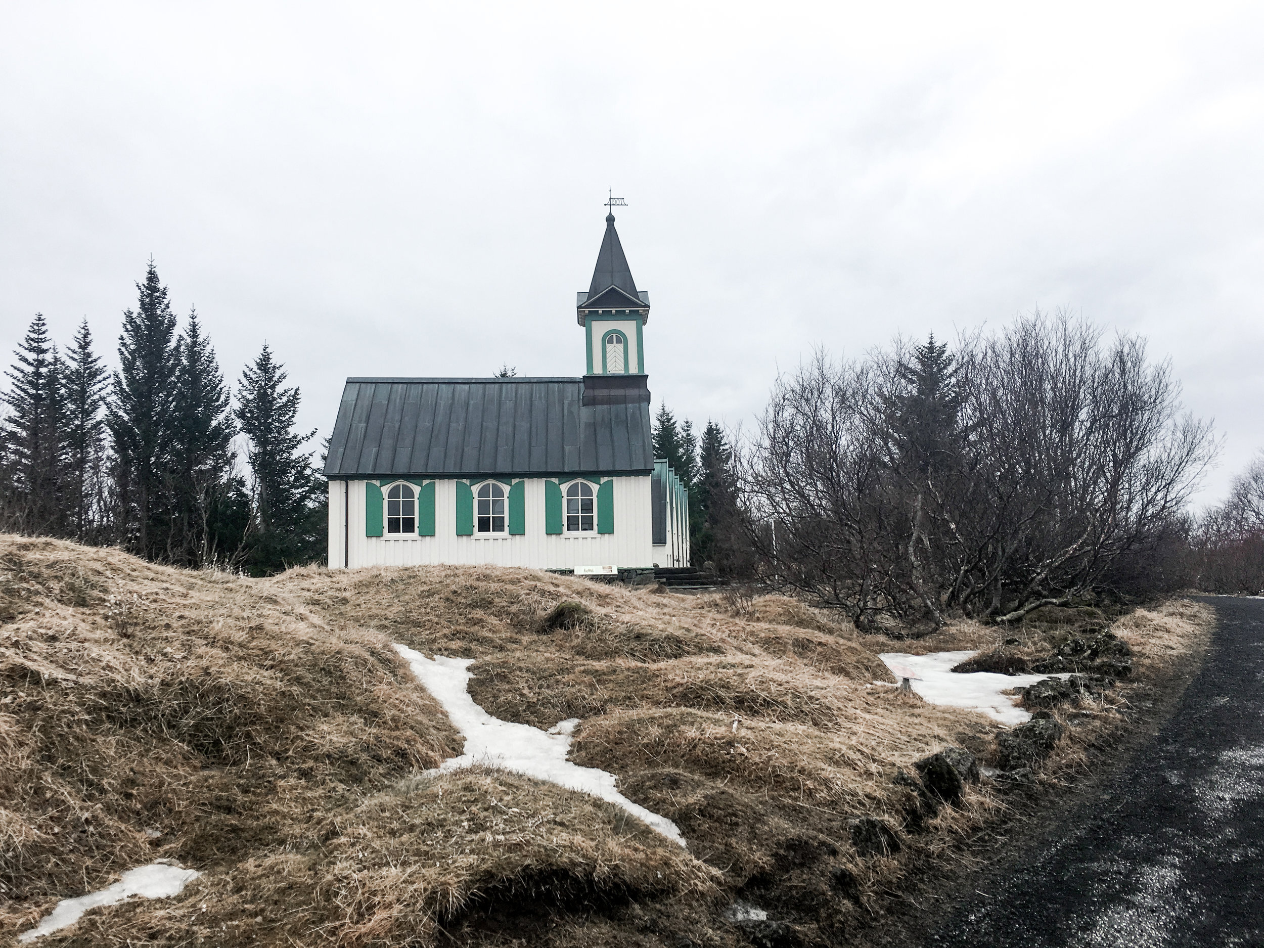 An old church in Iceland is nestled in the landscape in this travel photography collection
