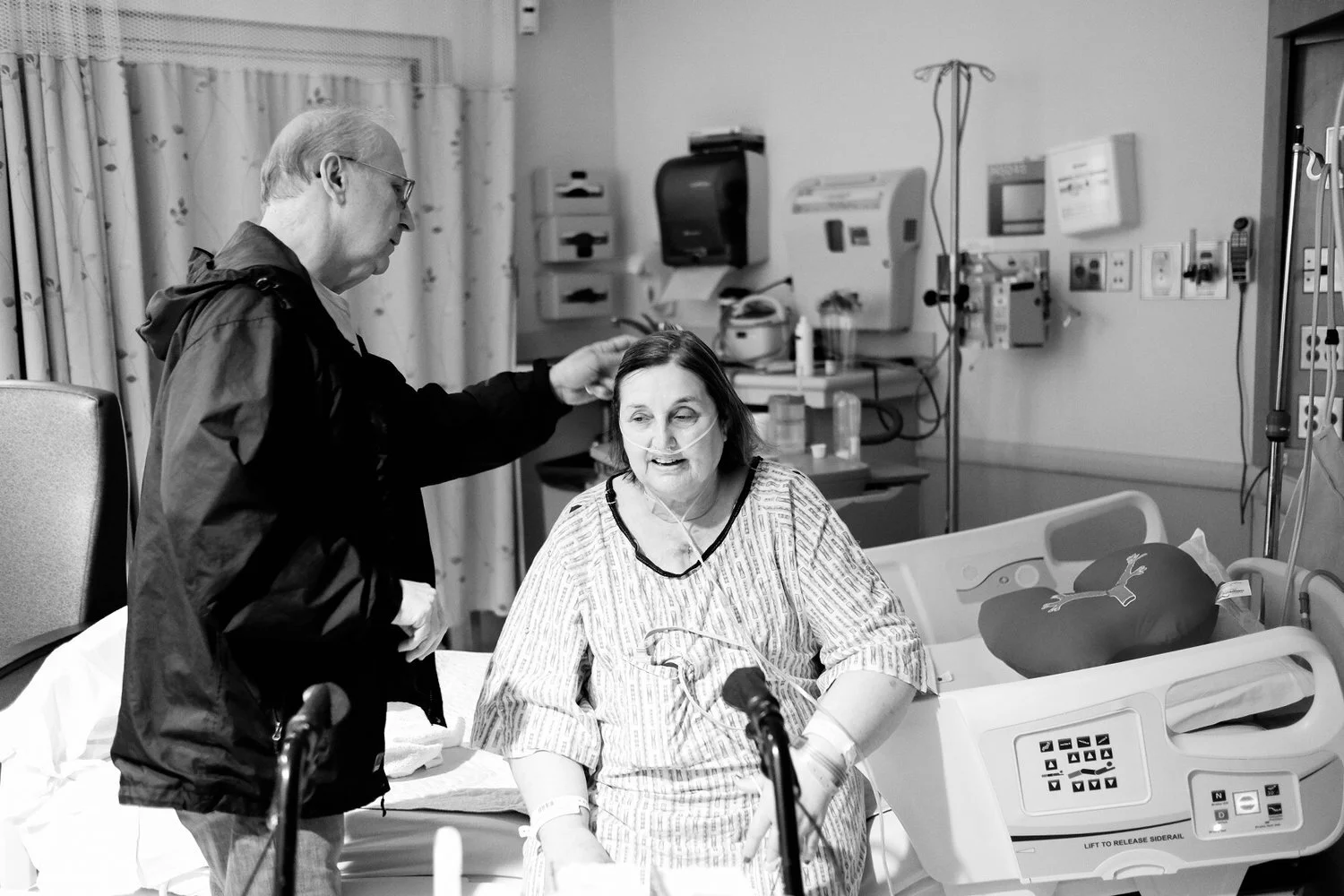 Documentary image of mom sitting on a hospital post-surgery