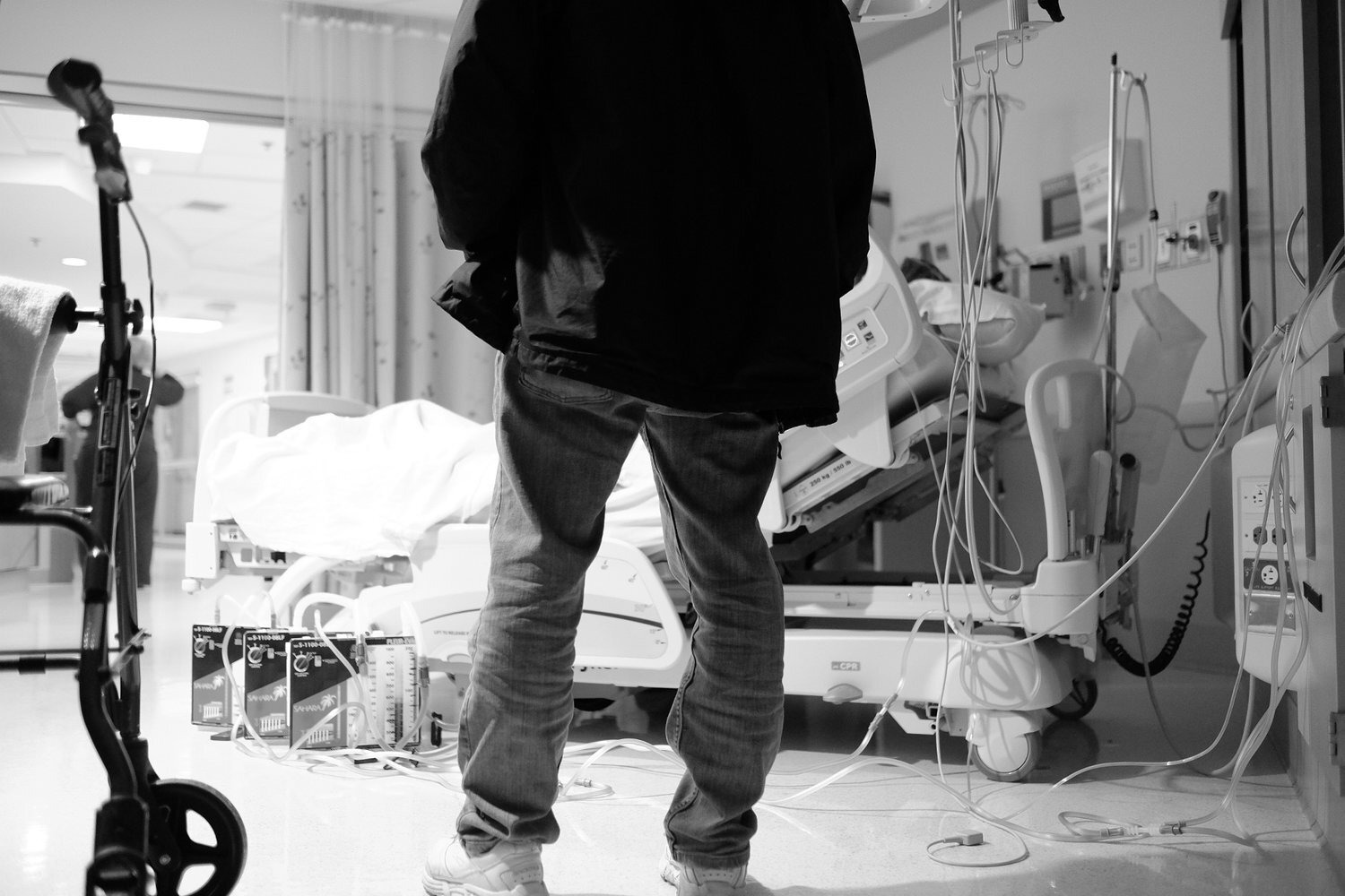 Documentary photo of my dad watching my mom after heart surgery