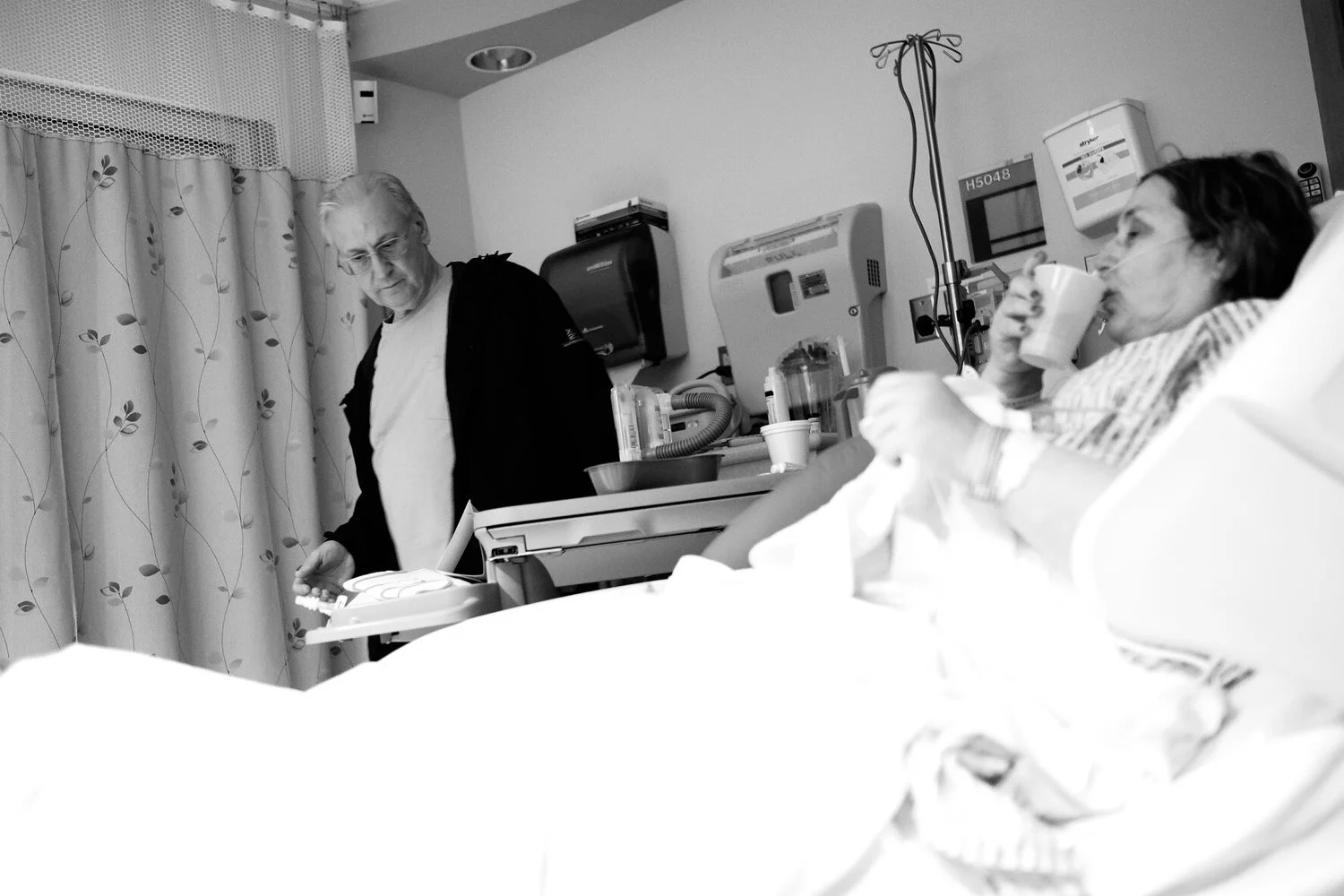 Mom sips on water after surgery