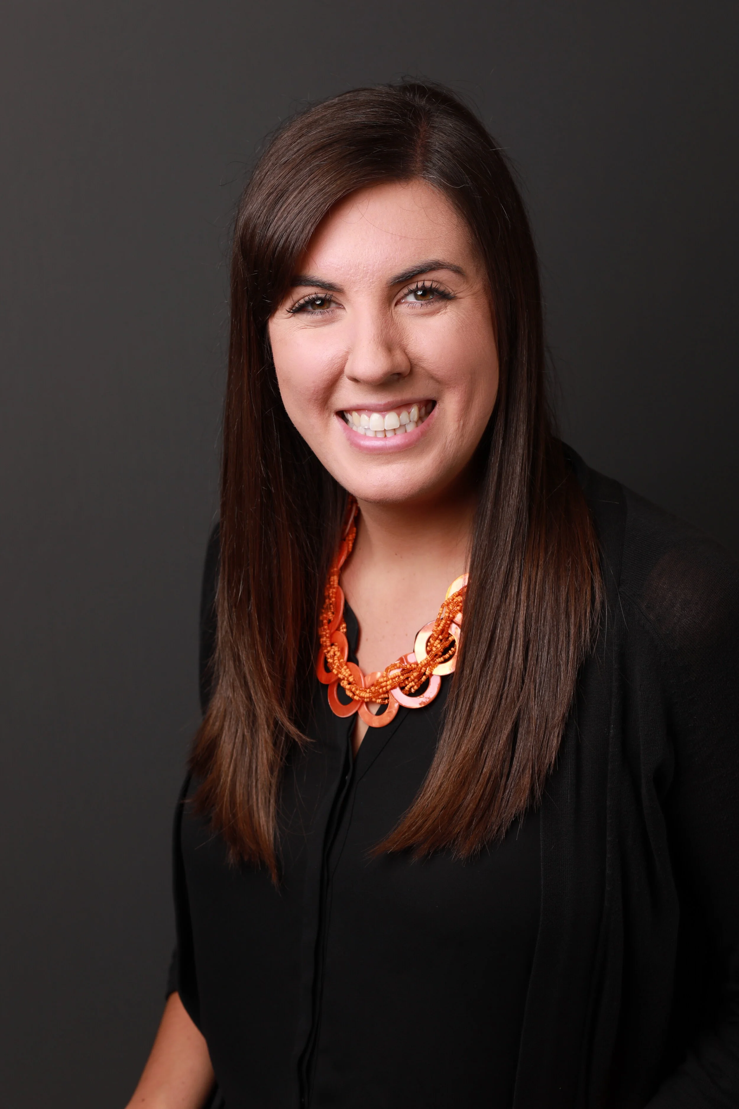 Headshot of a woman with a chunky necklace