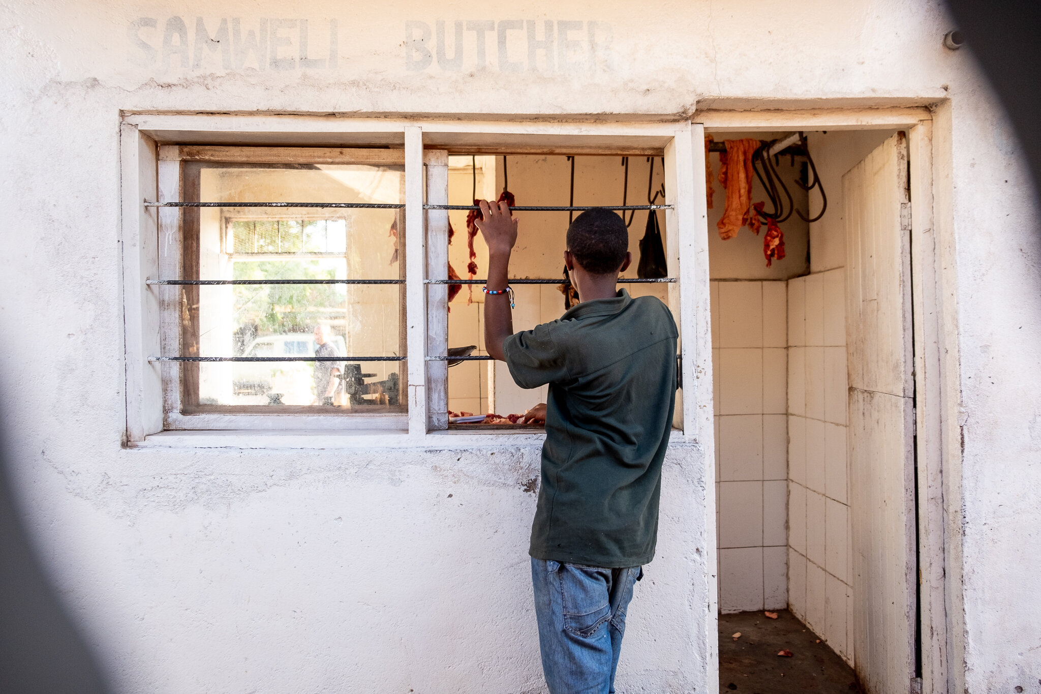 A photo essay features a local butcher in Tanzania 