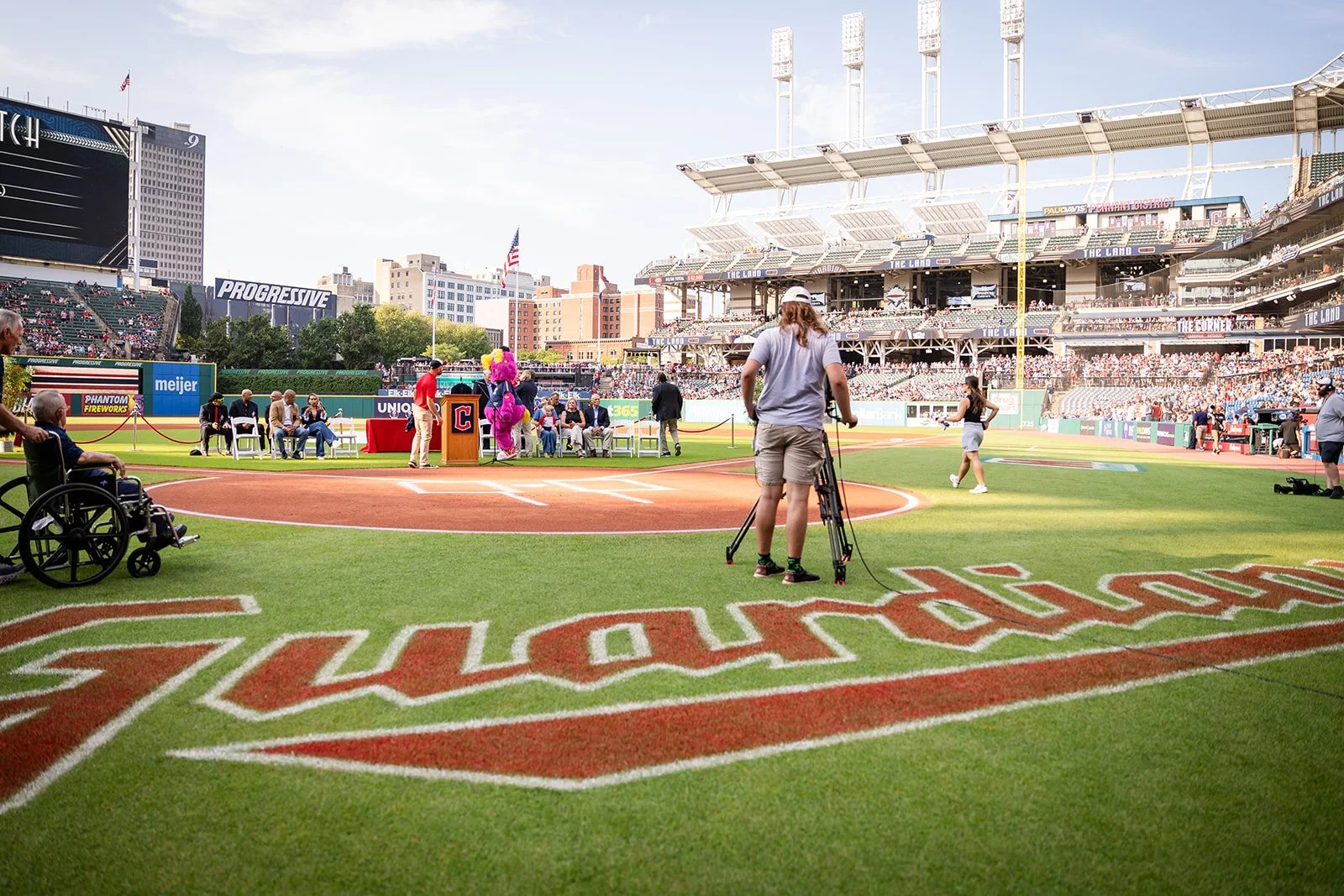 A camera crew gets ready to film a hall of fame induction ceremony at the Cleveland Guardians baseball stadium