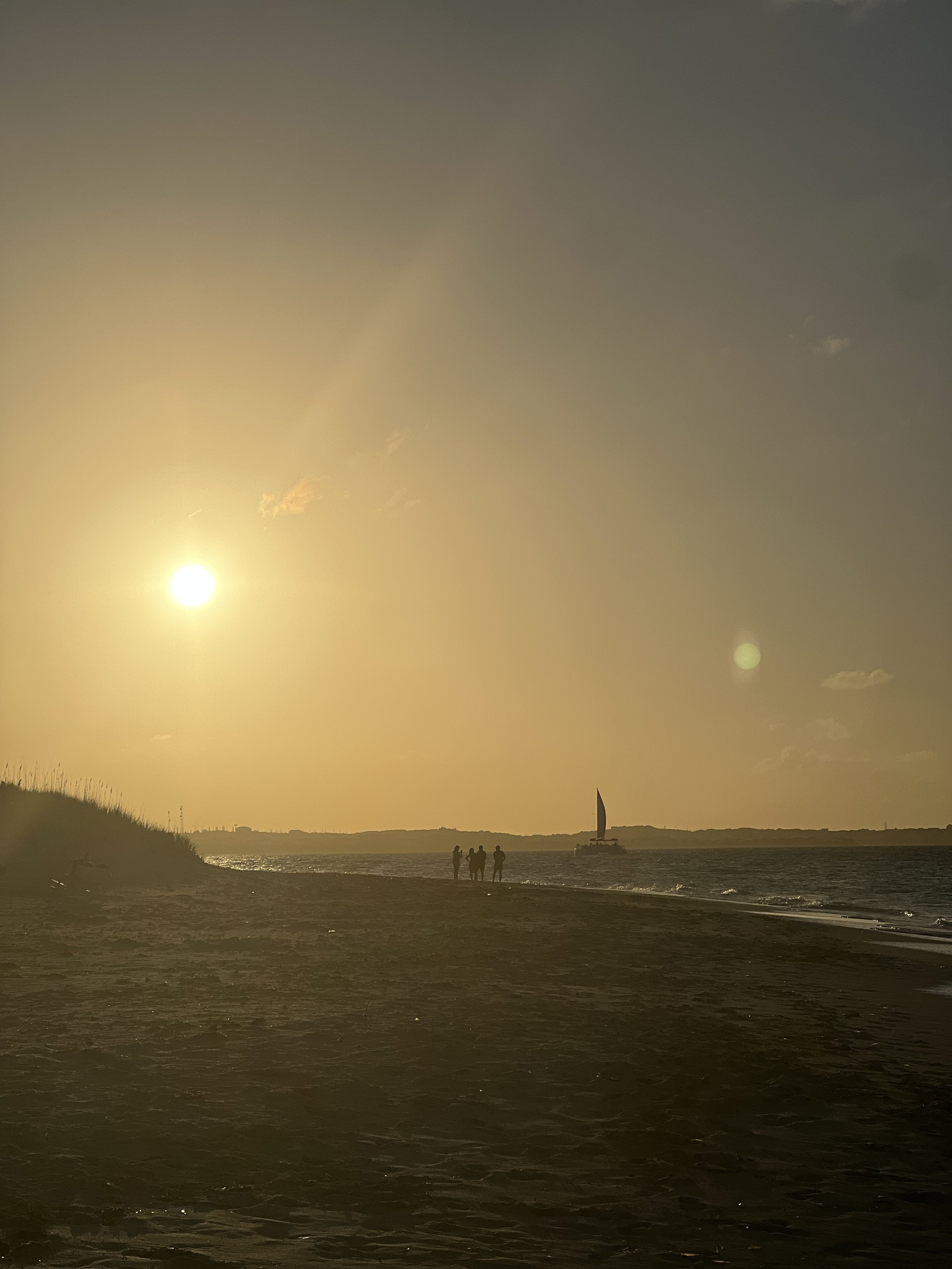 Enjoy a sunset on the white sand beaches of Turks & Caicos.