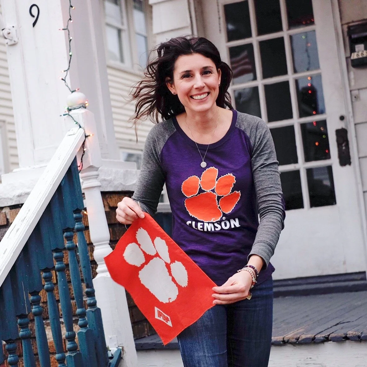 Holding the Clemson University IPTAY flag