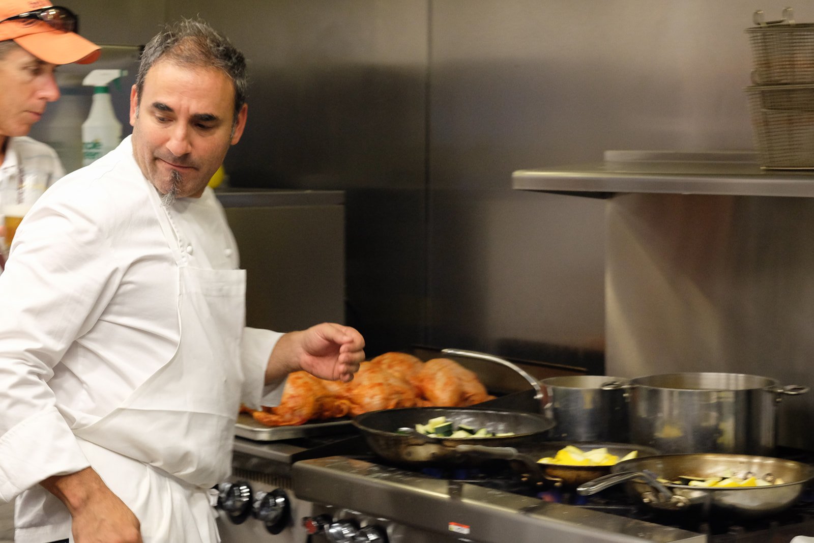 Chef Dante Bocuzzi prepares a meal at Kalman & Pabst Photo Group following a foraging event