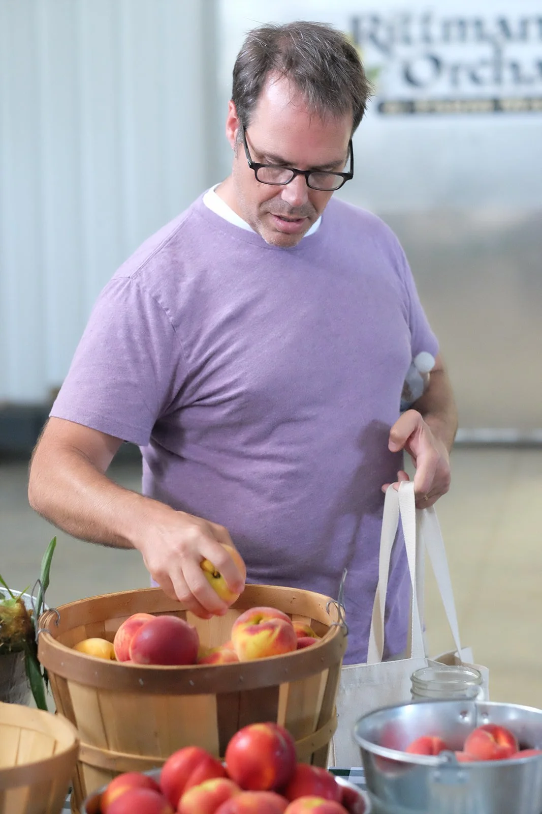 Chef Doug Katz selects fresh apples for his latest dish