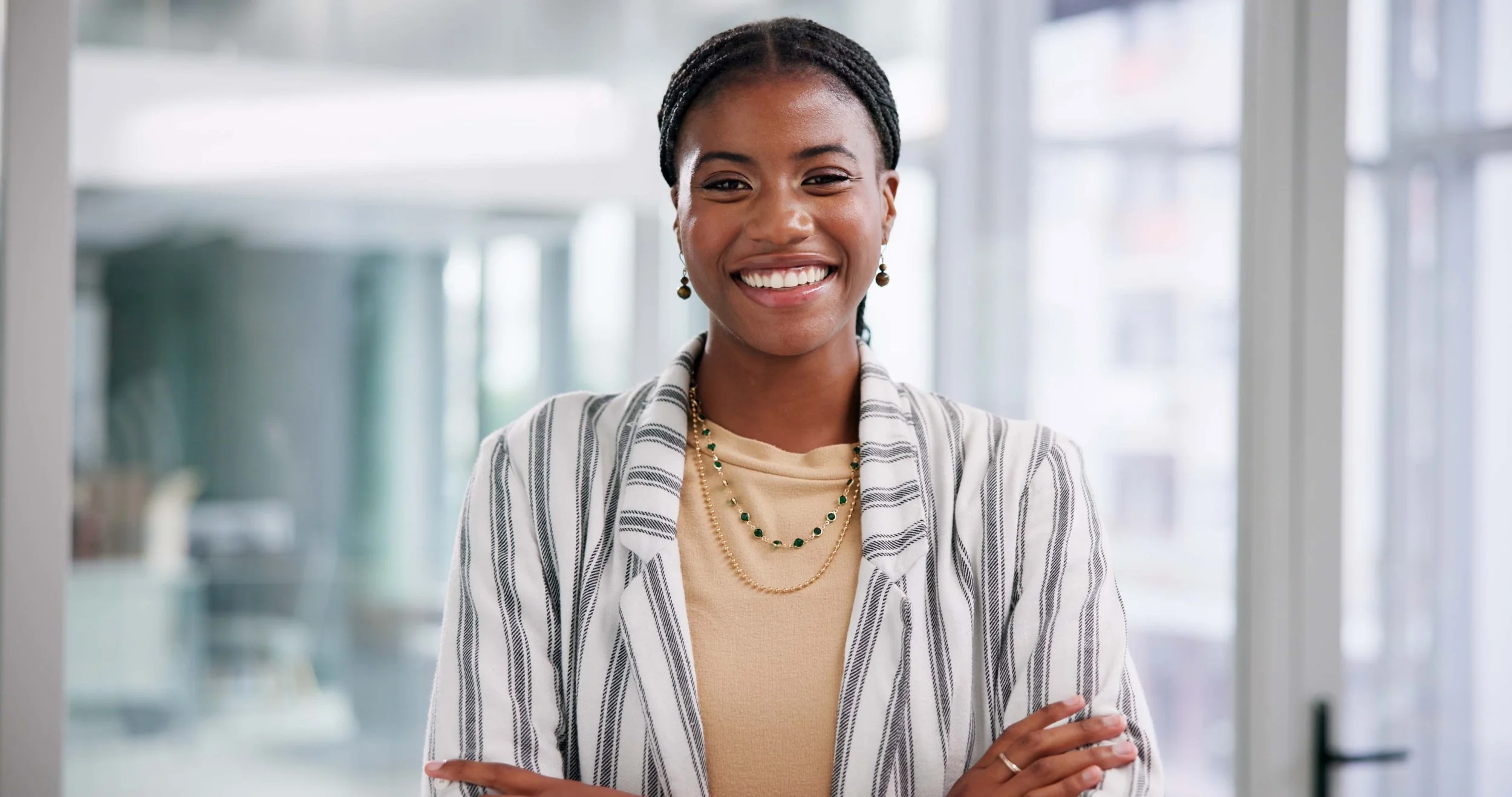 Black professional woman showcases an outfit with patterns that aren't busy for a professional headshot