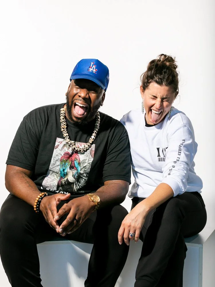 Coworkers goofing around while waiting for their turn at a team headshot session