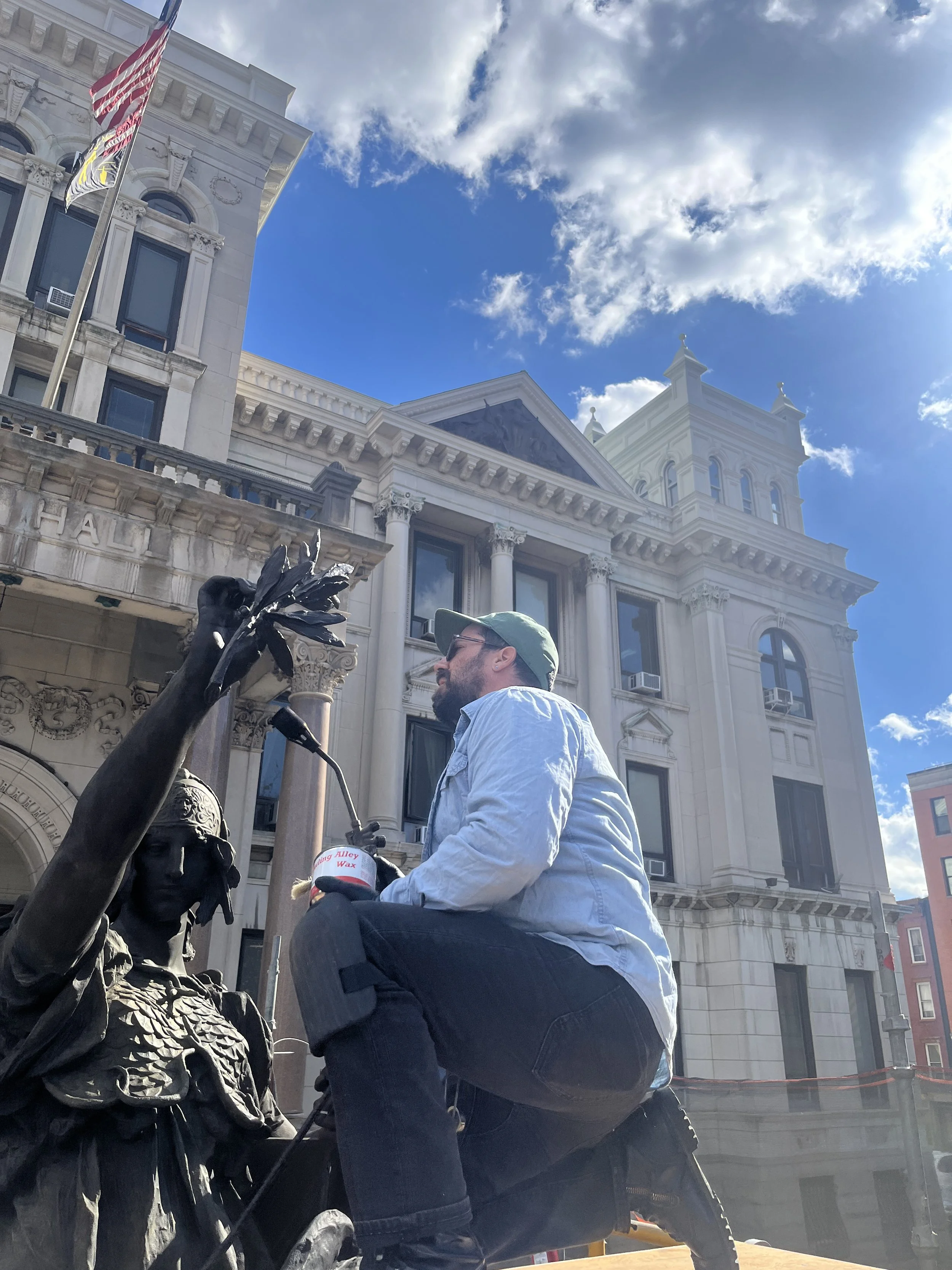 Seth Gartland conserving an outdoor bronze sculpture in New Jersey