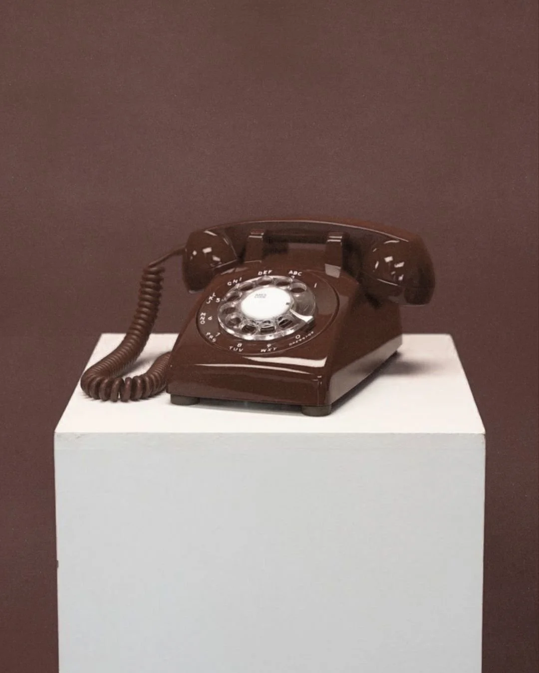 A brown rotary dial telephone signaling the social media management and strategy arm of our calgary based marketing agency