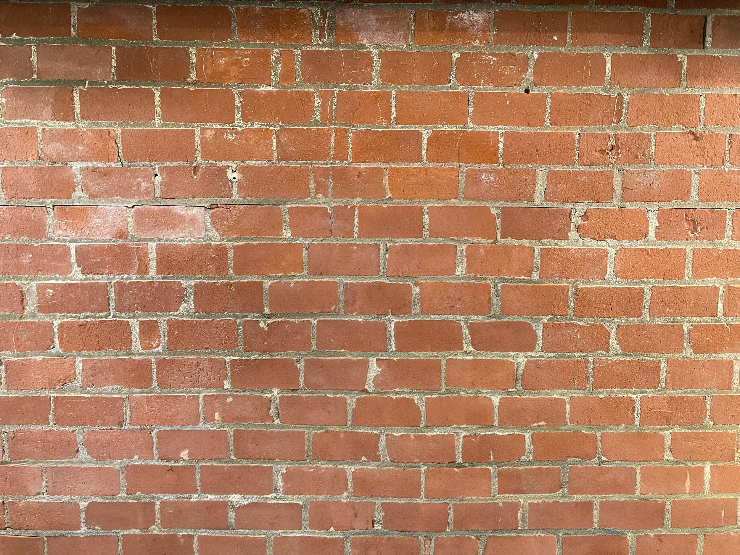Exposed red brick wall backdrop in a private Los Angeles fitness and content creation studio, ideal for fitness photography, interviews, and editorial lifestyle shoots.