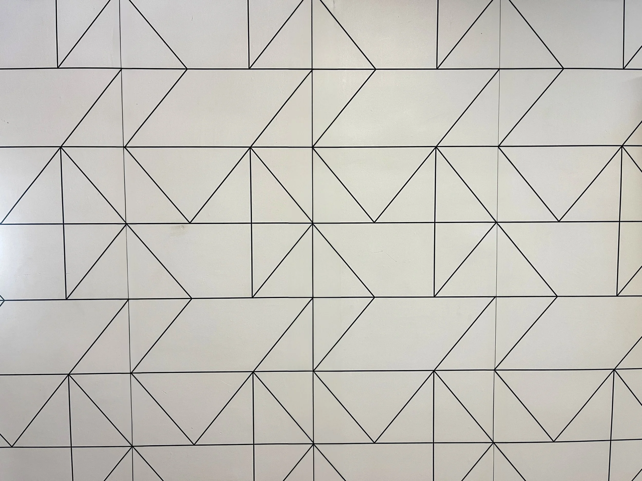 Geometric patterned wall backdrop in a private Los Angeles fitness and content creation studio, ideal for editorial portraits, branding photos, and modern lifestyle shoots.