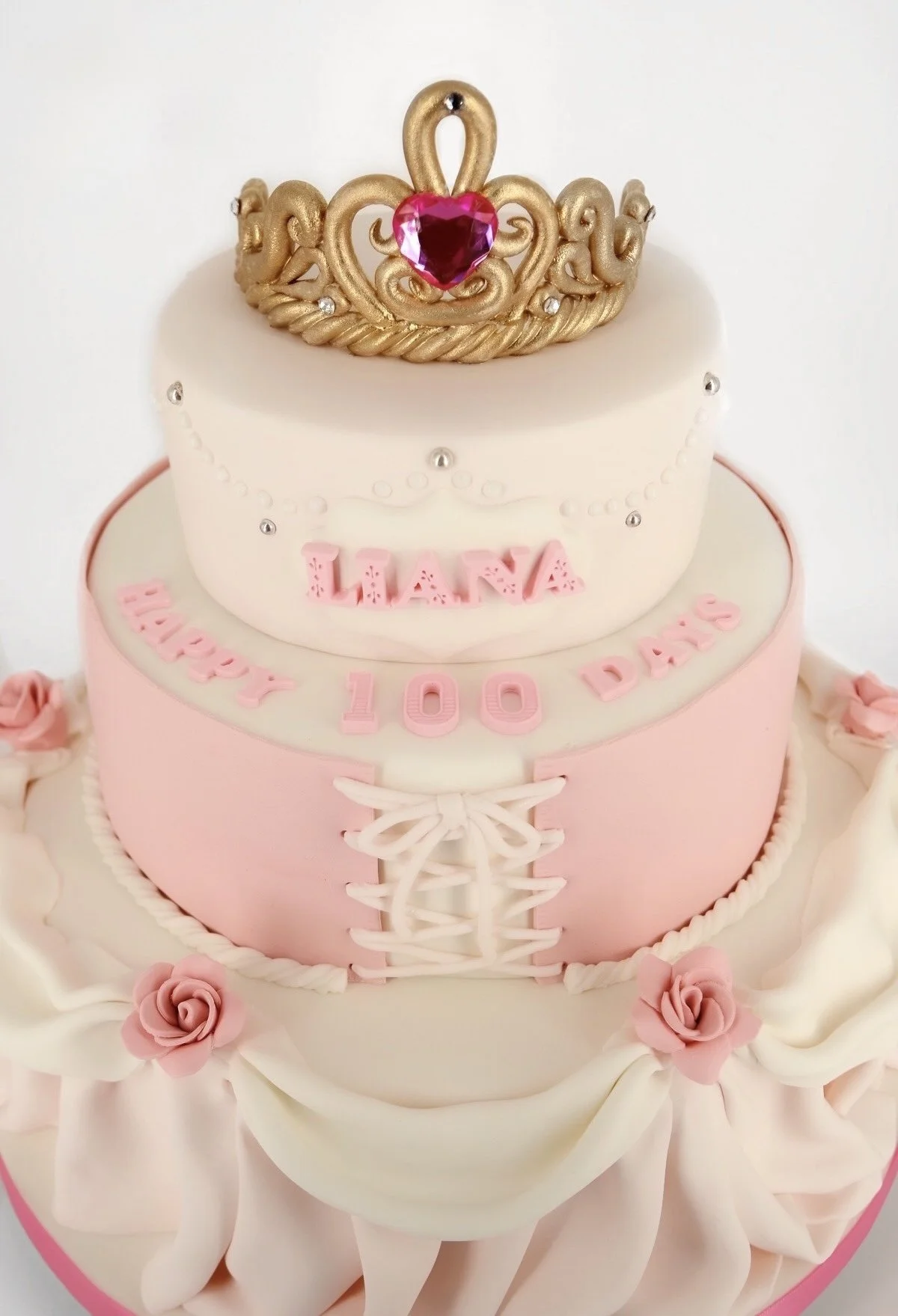 Oreo cookies, Hershey's chocolates, and cream dollops on a cookies and cream cake.