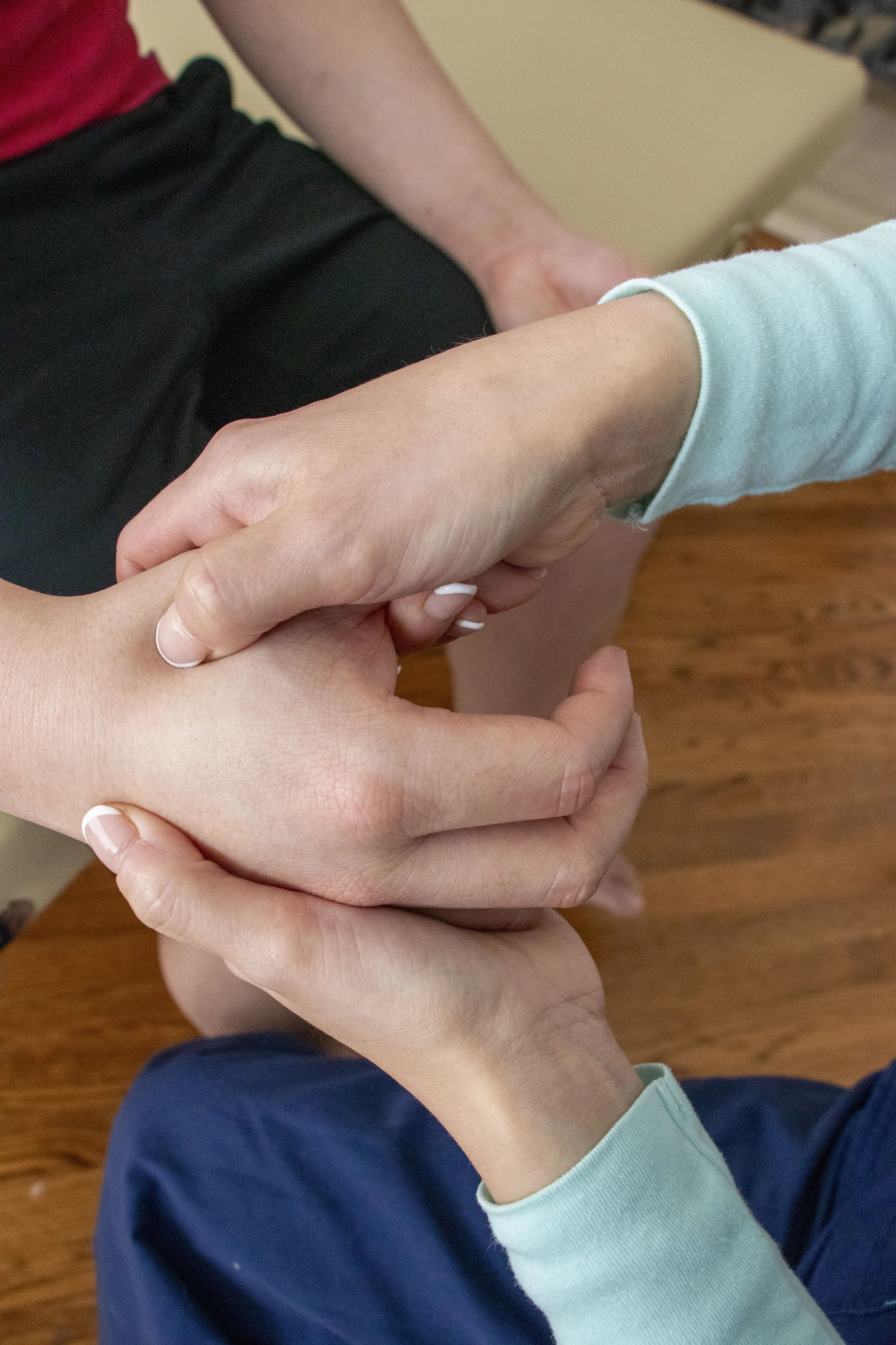 Osteopathic Manipulation on a patient's hand.