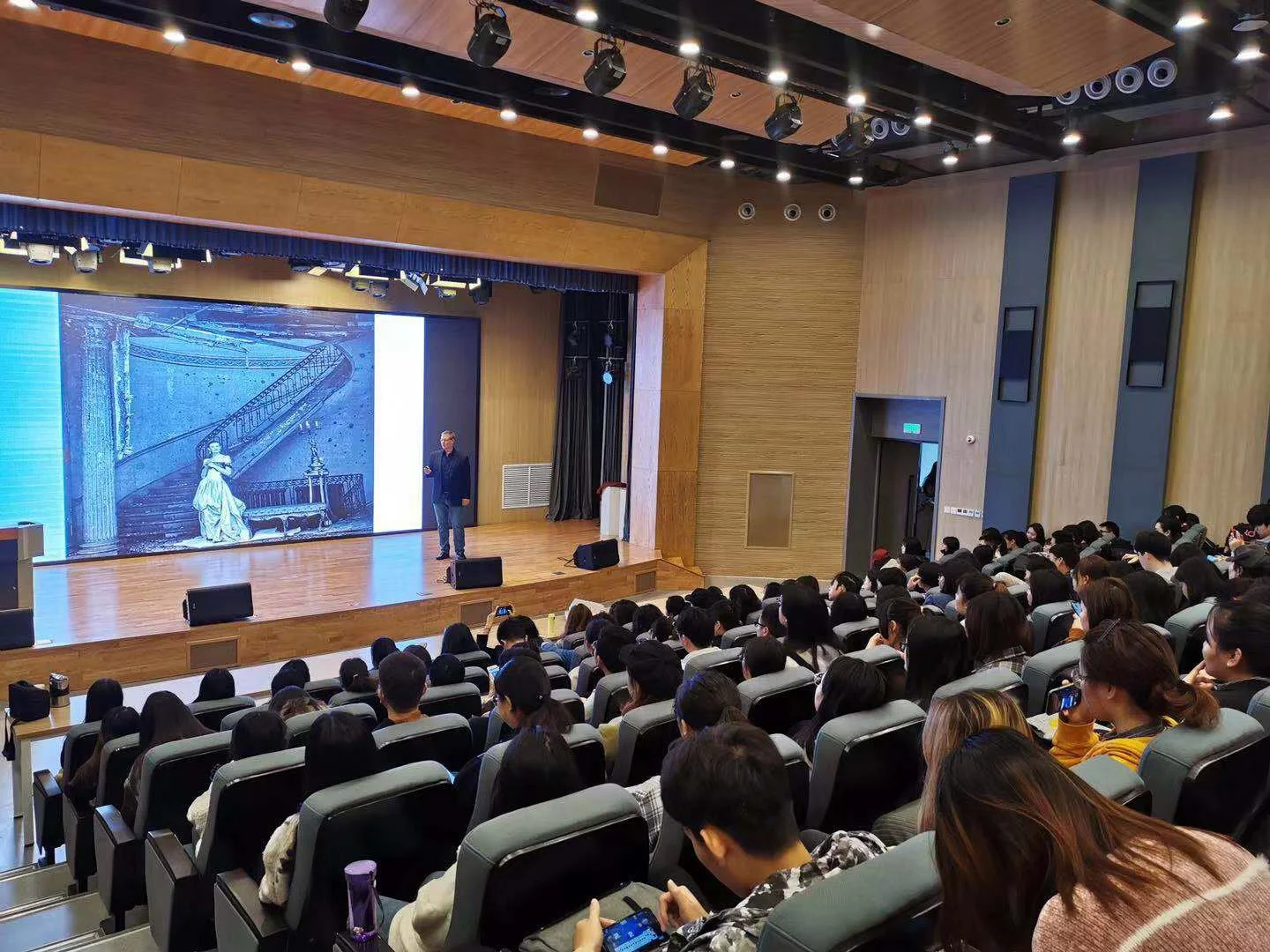 Thomas Werner speaking on stage about his book.