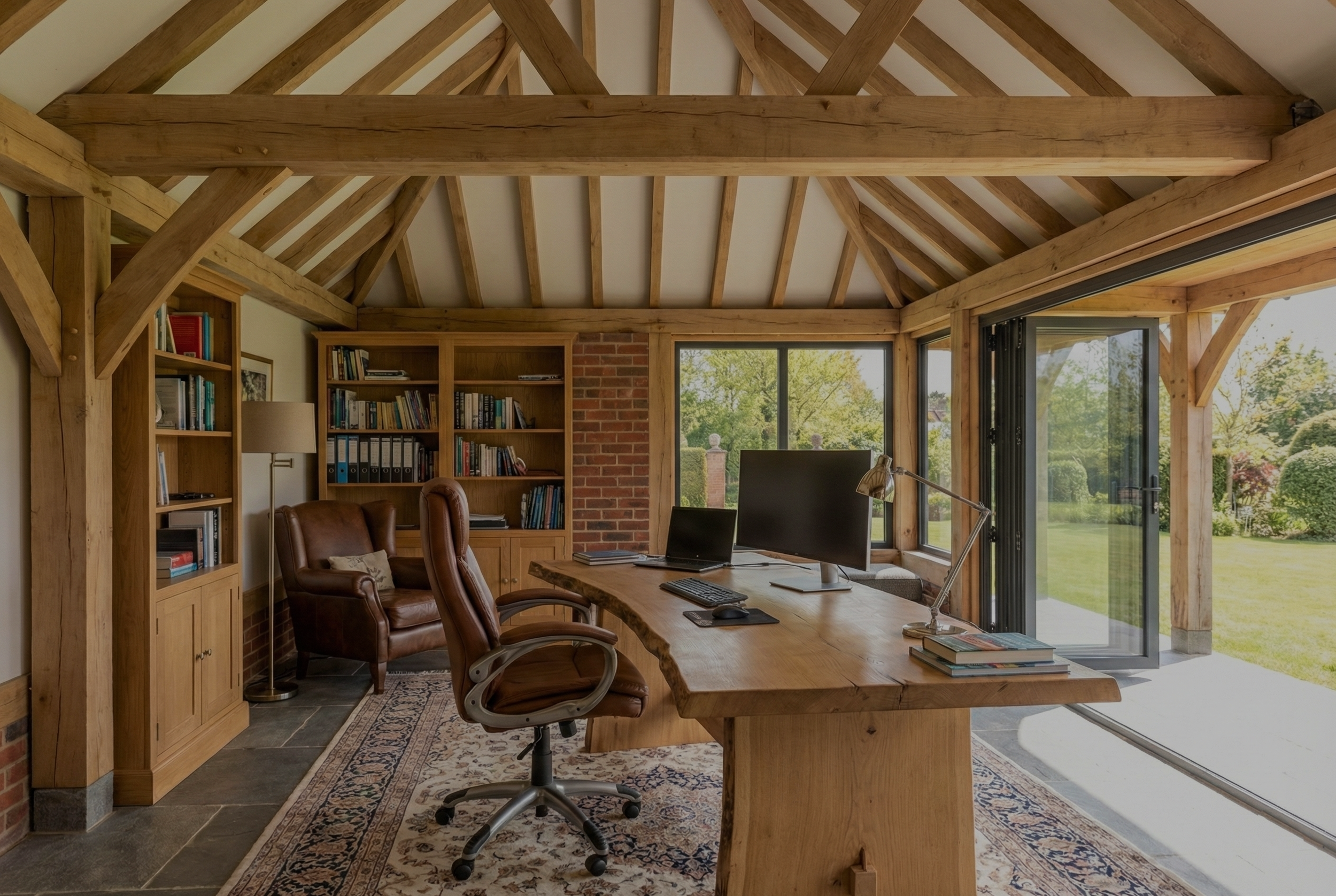 Luxury oak framed garden home office extension with traditional timber joints and high-quality glazing.