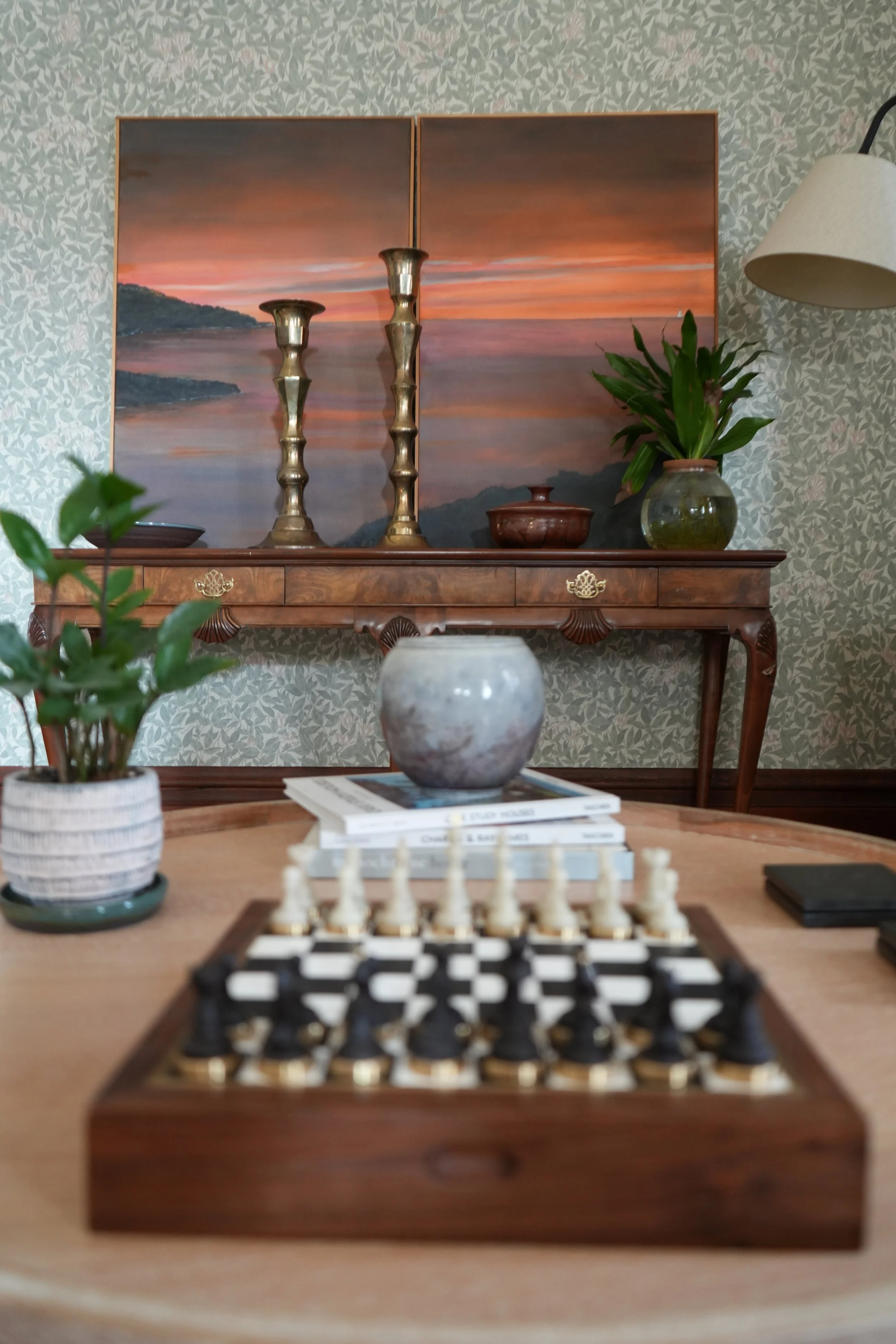 Living room at 930 South in Salt Lake City with layered furnishings, warm wood details, artwork, and natural light.