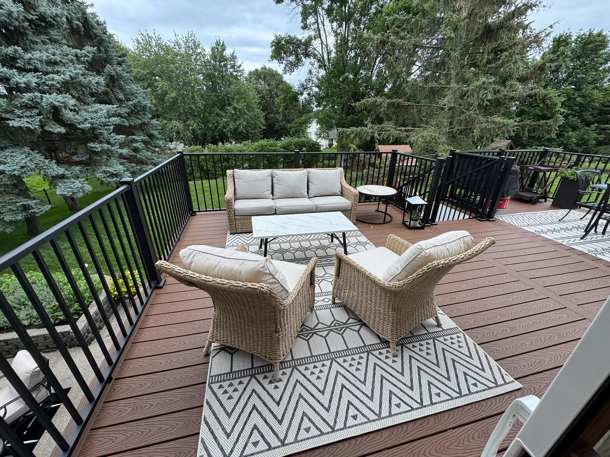 Spacious Trex composite deck connecting home to backyard.JPG