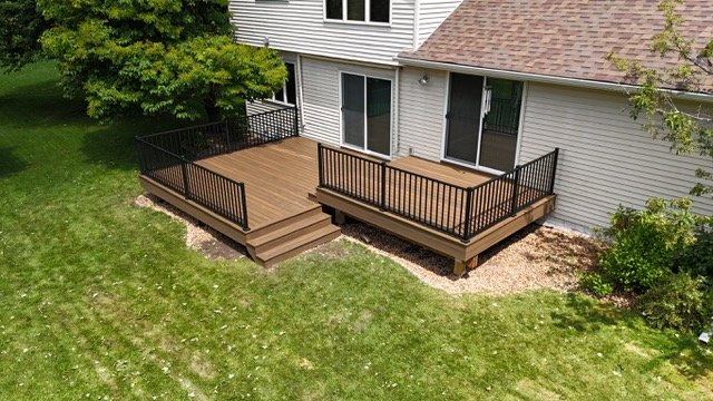 Professional deck framing supporting Trex composite deck surface.jpeg
