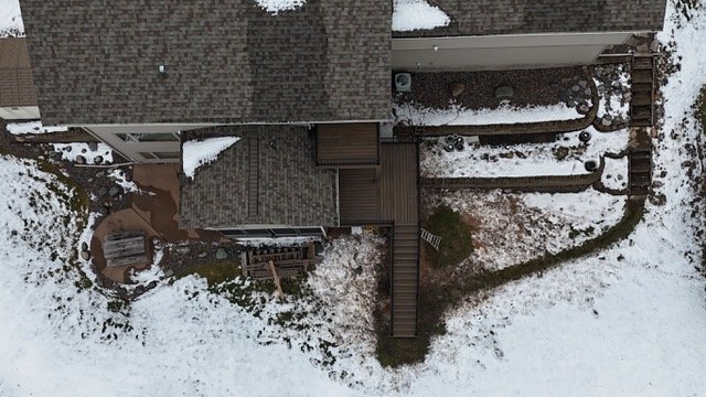 snowy backyard with trex composite decking.jpeg