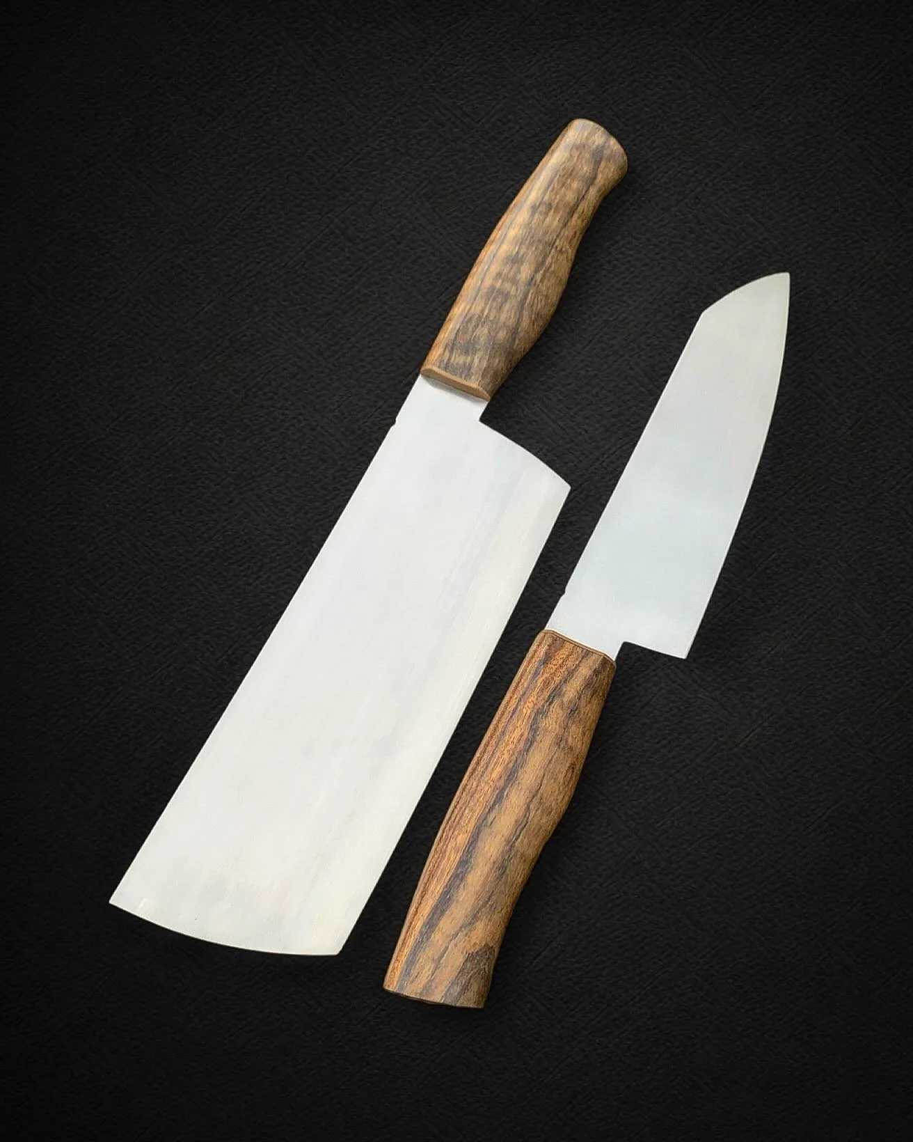 The Holiday push continues&hellip;😅

If your order is already in it&rsquo;ll be delivered on time🤘

AEBL Cleaver and Santoku w/ Curly Mango Handles 
.
.
.
.

#madeinusa #chef #handmade #chefknife #chef #gyuto #santoku #cheflife🔪 #heartwood #cutyou