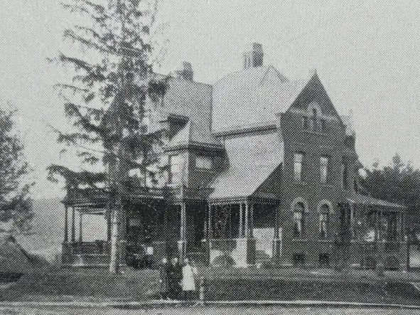 Showing the house circa 1900, this picture includes the driveway portico, which was removed between 1939 and 1950. Also visible are the rear kitchen chimney and the original main chimney - in the 1950s, the kitchen chimney was removed, and the main c