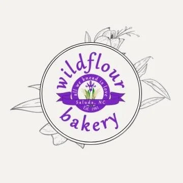 Logo for Wildflower Bakery featuring a purple and white circular design with wildflowers in the background.