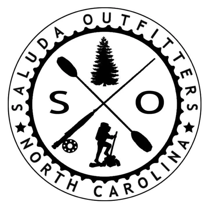 Circular logo with words "SALUDA OUTFITTERS North Carolina" around the outer edge. Inside, there are images of a pine tree, a person hiking with a backpack, and a canoe paddle. Two crossed paddles and a painter's palette are also inside the circle.