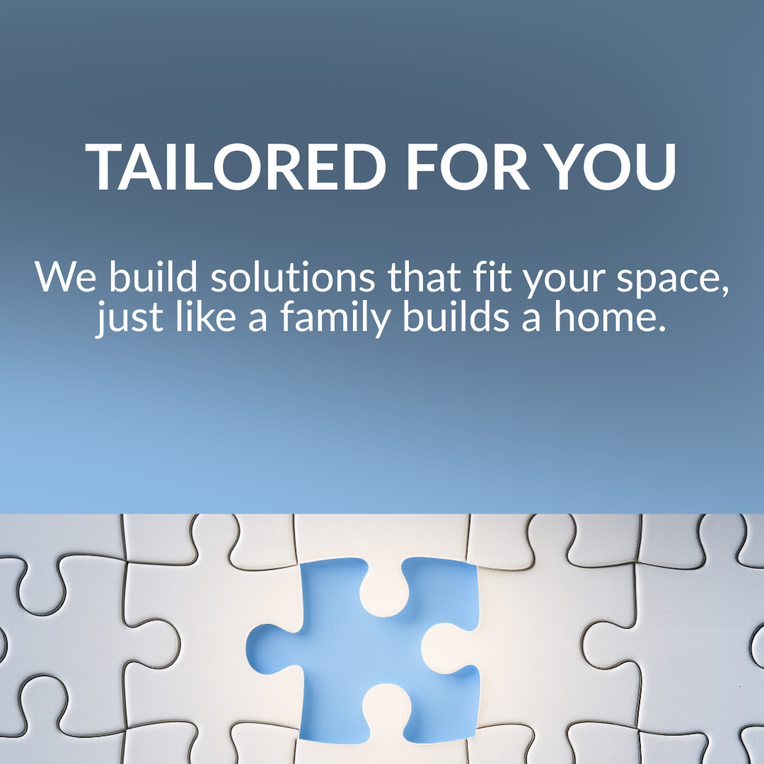 A promotional graphic with the text 'Tailored for You' and 'We build solutions that fit your space, just like a family builds a home,' featuring a partially assembled white jigsaw puzzle with a missing piece on a blue background.