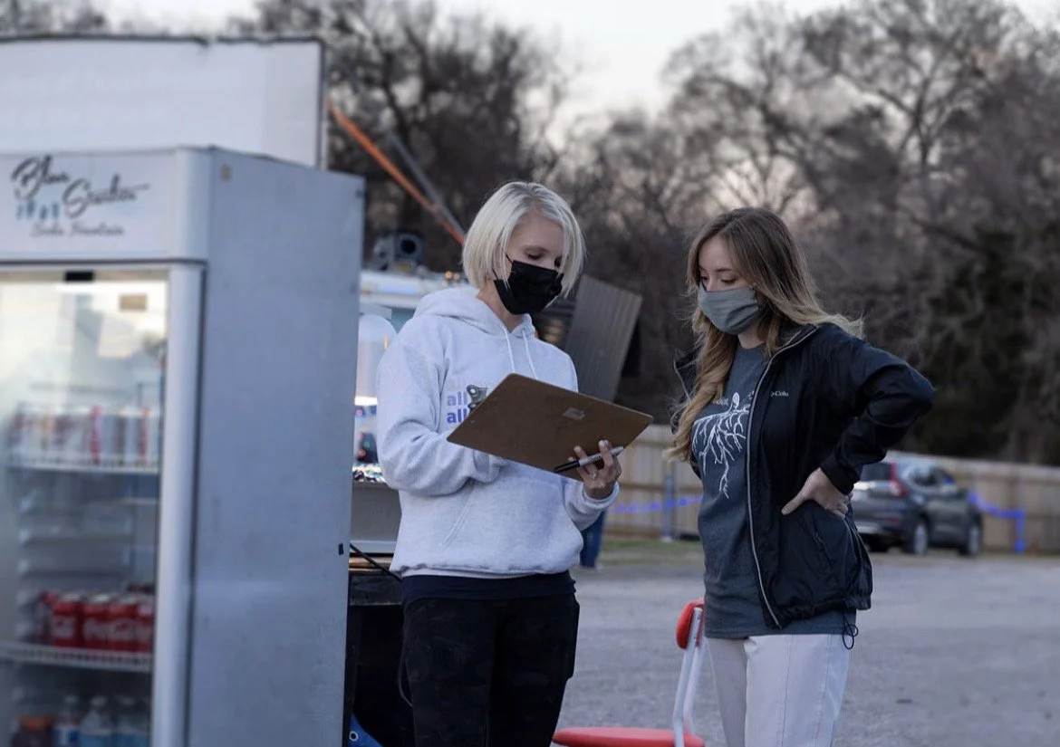 Assisting during a fundraising event for Refugee Services of Texas. 