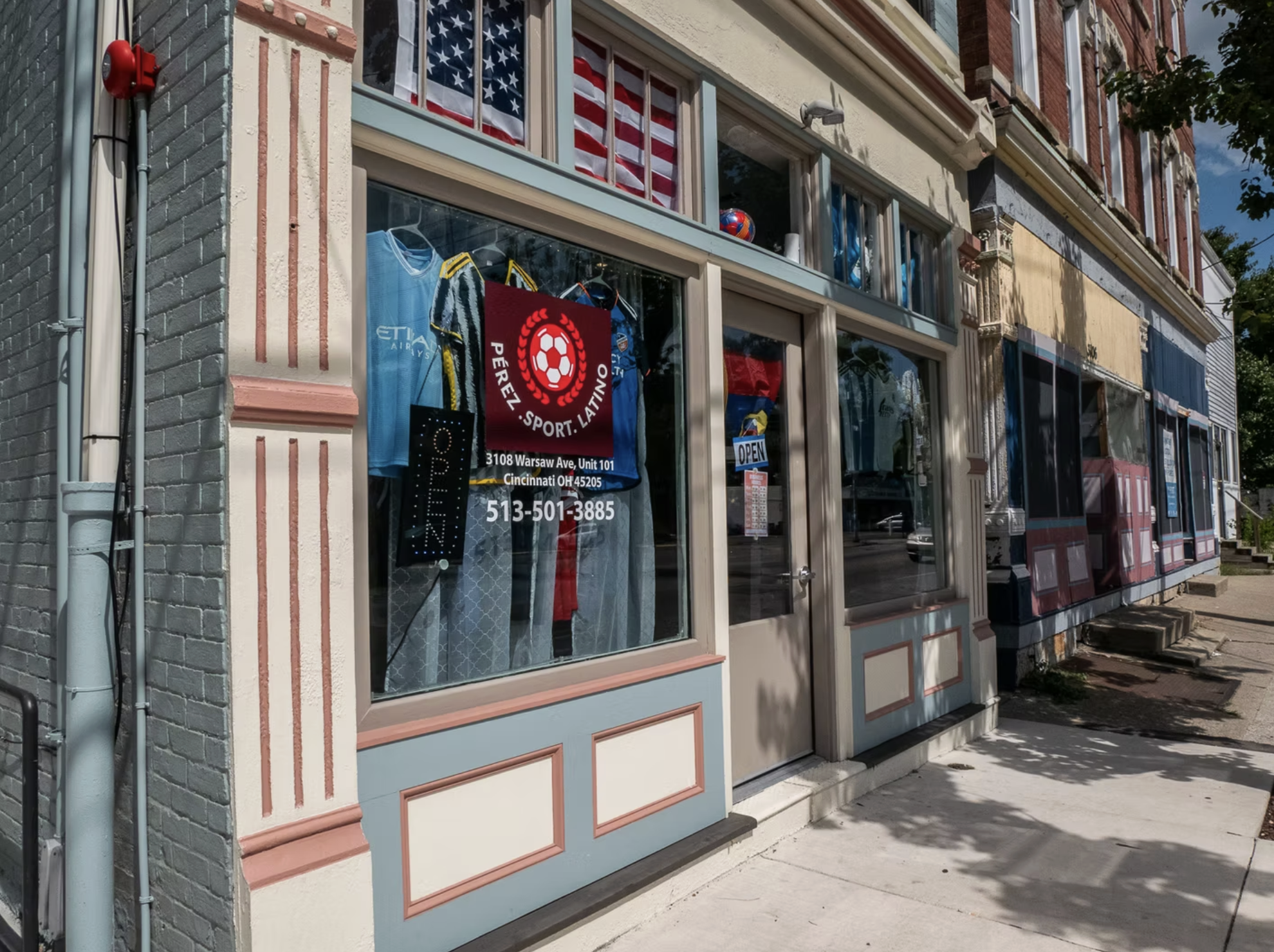 Soccer store with sports jerseys, flags, and sports equipment displayed in the windows, located at 3108 Warsaw Avenue, Cincinnati, Ohio