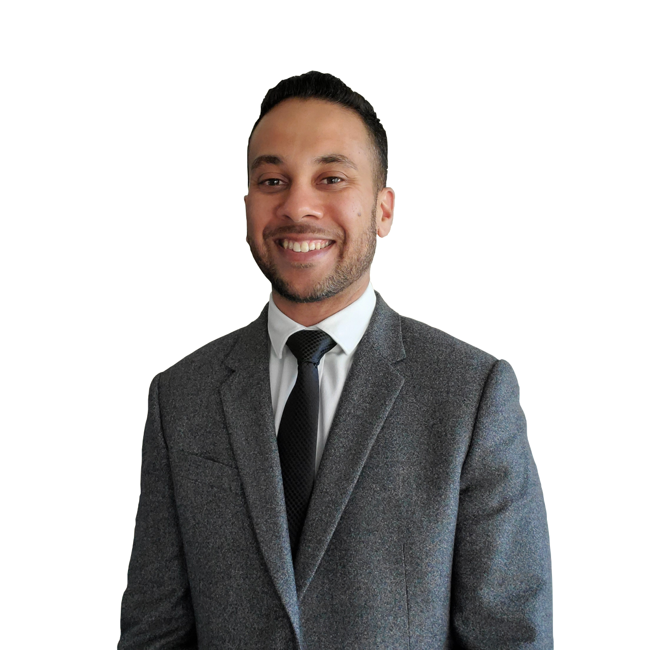 A smiling man in a grey suit with a white shirt and black tie, posing against a black background.