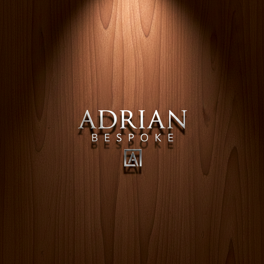 Wooden surface with text reading 'Adrian Bespoke' and a small logo underneath.