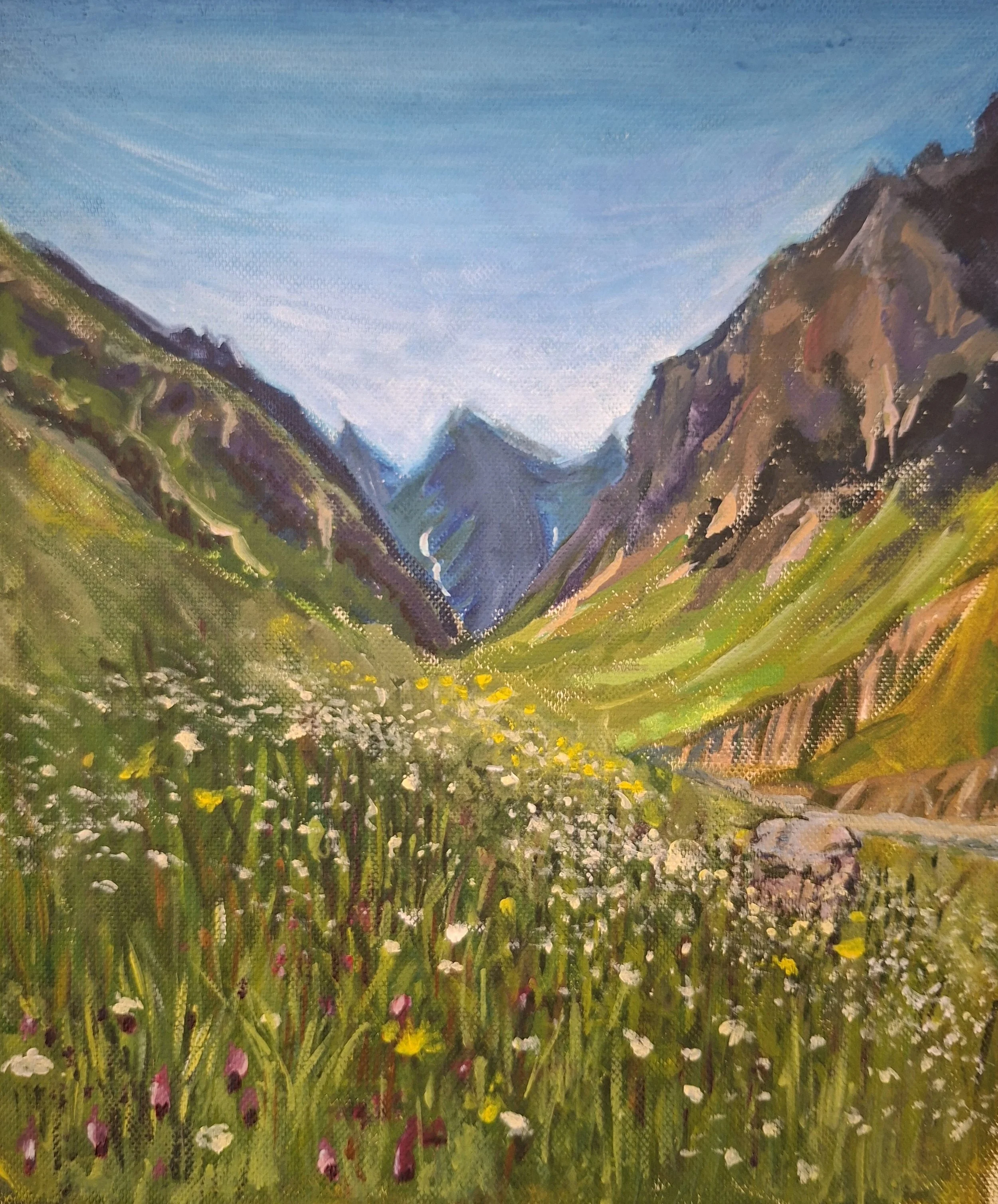 A painting of a mountain valley with green grass, wildflowers, and tall mountains under a clear blue sky.
