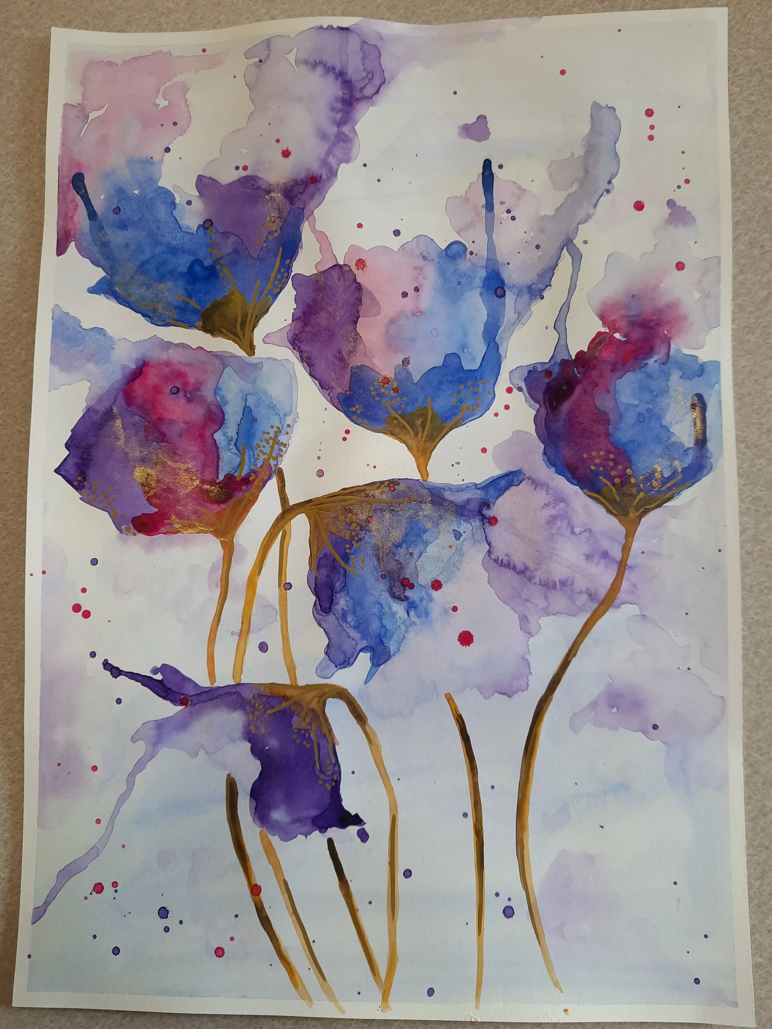 Watercolor painting of purple and blue flowers with gold accents, on white background.