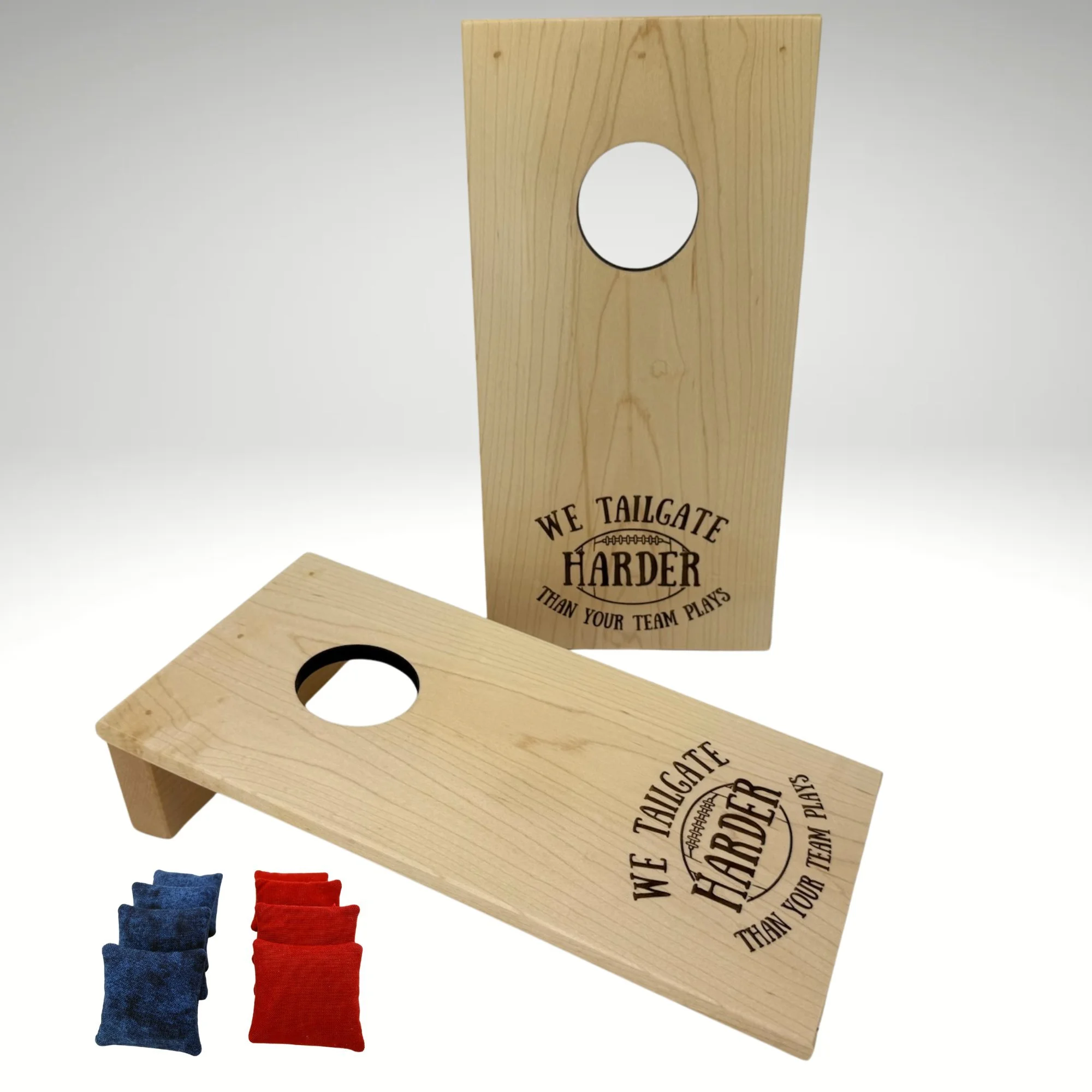 Handcrafted tabletop mini cornhole boards made from solid hardwood, maple wood, and engraved with tailgating