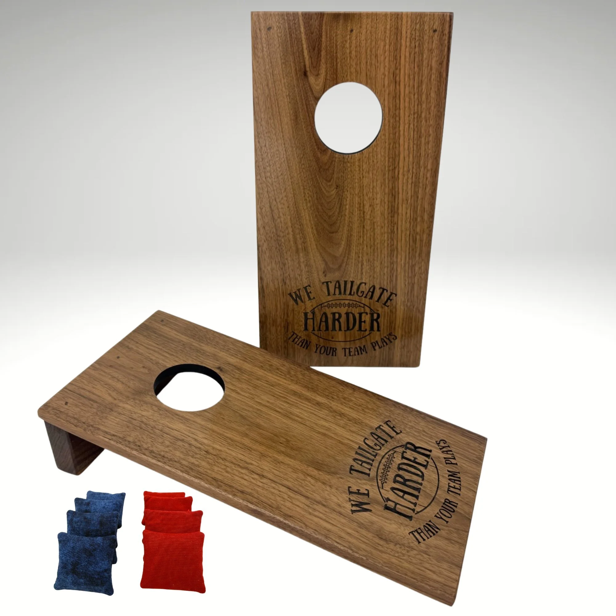 Handcrafted tabletop mini cornhole boards made from solid hardwood, walnut wood, and engraved with tailgating