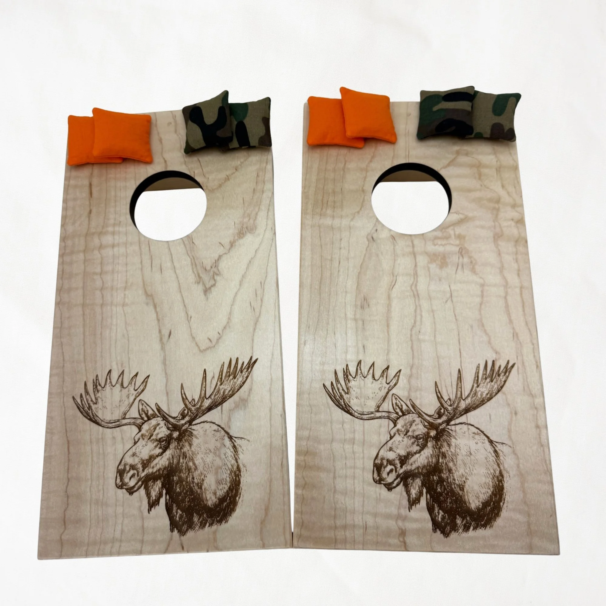 Handcrafted tabletop mini cornhole boards made from solid hardwood, maple wood, engraved with a moose